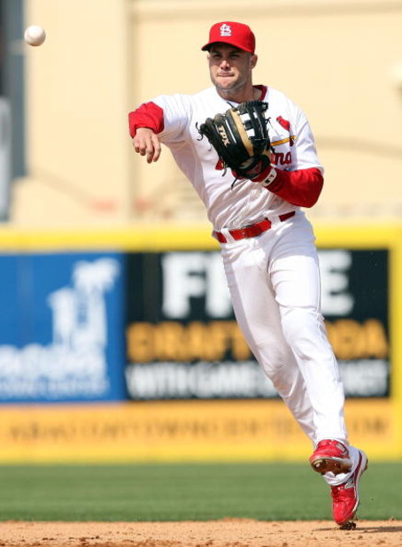 JUPITER, FL - MARCH 02:  Second baseman Skip Schumaker #55 of the St. Louis Cardinals tries to throw out Evan Longoria #3 of the Tampa Bay Rays during a spring training game at Roger Dean Stadium on March 2, 2009 in Jupiter, Florida. The Rays defeated the