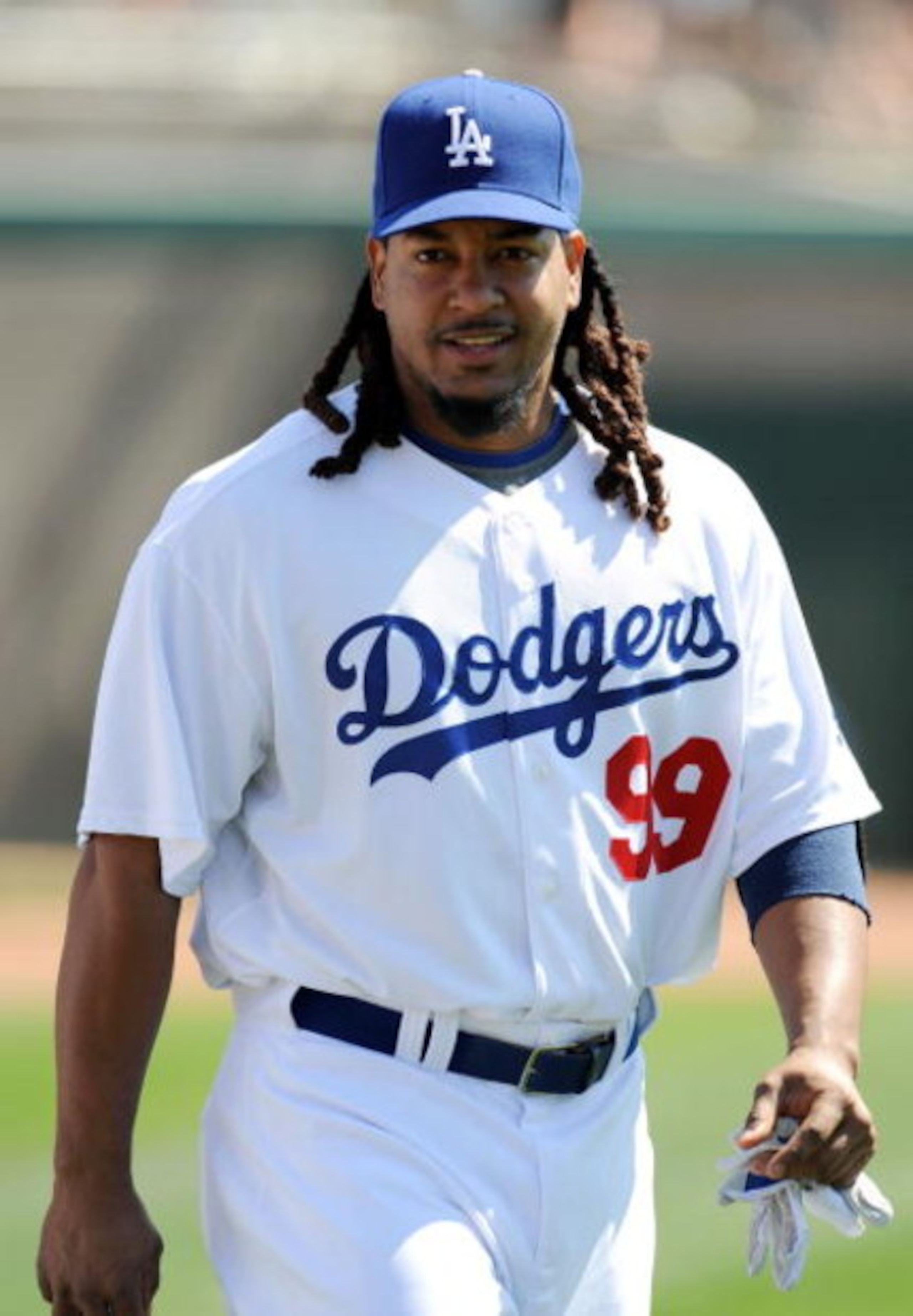 GLENDALE, AZ - MARCH 13:   Manny Ramirez #99 of the Los Angeles Dodgers walks along the field before a Spring Training game against the Texas Rangers on March 13, 2009 at Camelback Ranch in Glendale, Arizona.  (Photo by Lisa Blumenfeld/Getty Images)