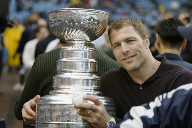 BRONX, NY - JUNE 13:  Defenseman Scott Stevens #4 of the New Jersey Devils poses for a picture with the Stanley Cup before the interleague game between the New York Yankees and the St. Louis Cardinals at Yankee Stadium on June 13, 2003 in the Bronx, New Y