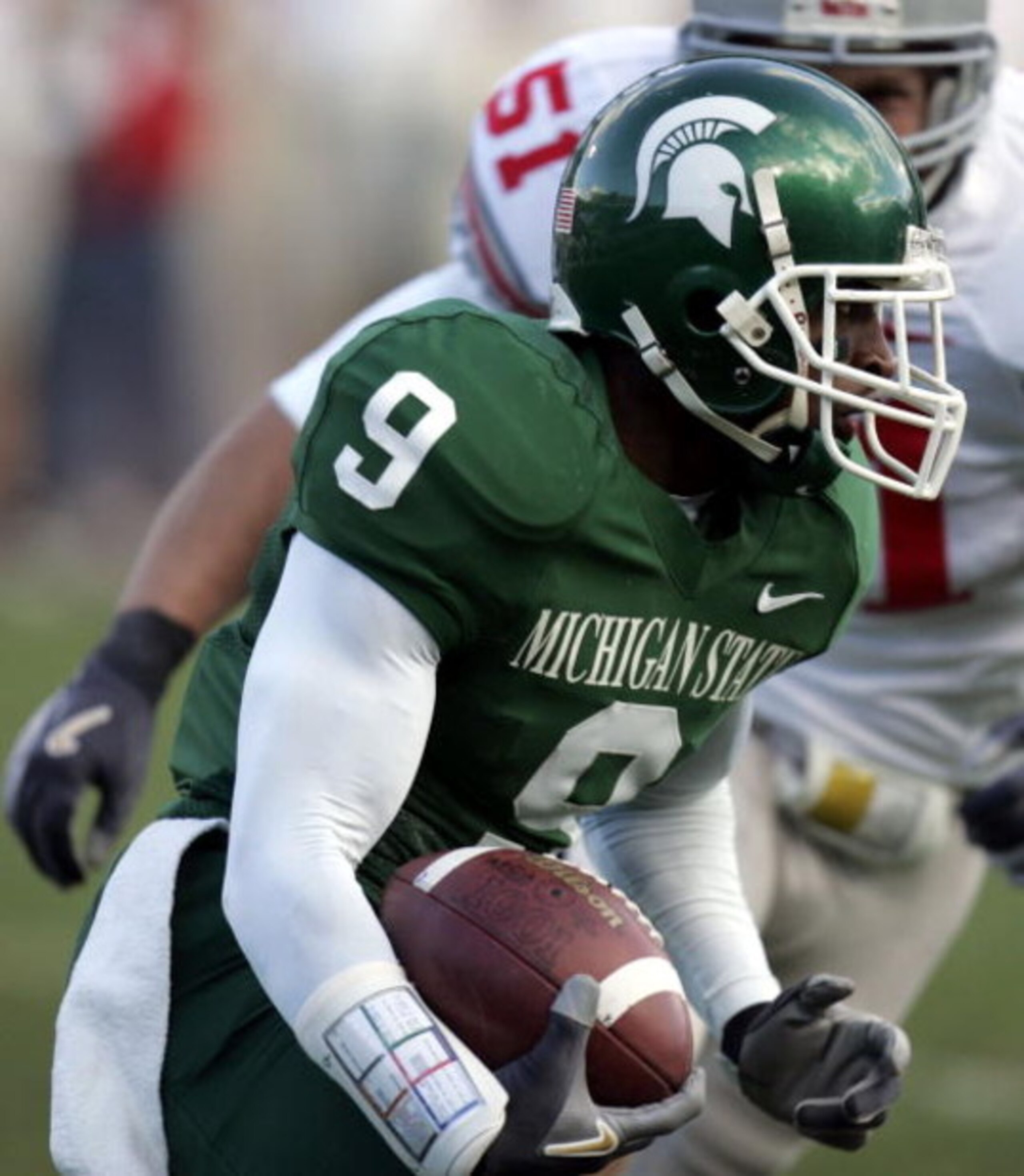EAST LANSING, MI - OCTOBER 14:  Demond Williams #9 of the Michigan State Spartans tries to get around the tackle of Ross Homan #51 of the Ohio State Buckeys during second quarter action on October 14, 2006 at Spartan Stadium in East Lansing, Michigan. Ohi