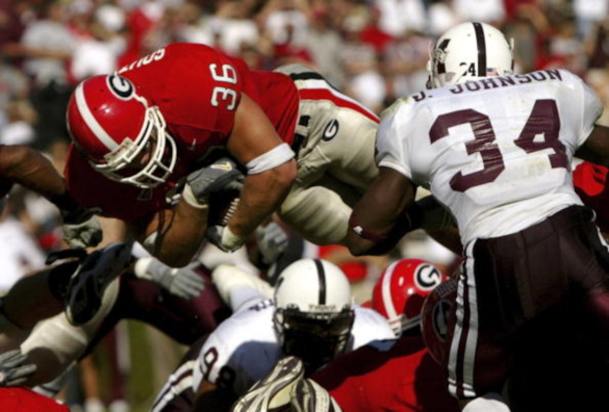 ATHENS, GA - OCTOBER 21:  Brannan Southerland #36 of the Georgia Bulldogs dives into the end zone in front of Jeramie Johnson #34 of the Mississippi State Bulldogs for a third quarter touchdown to make the score 27-17 during SEC college football action on