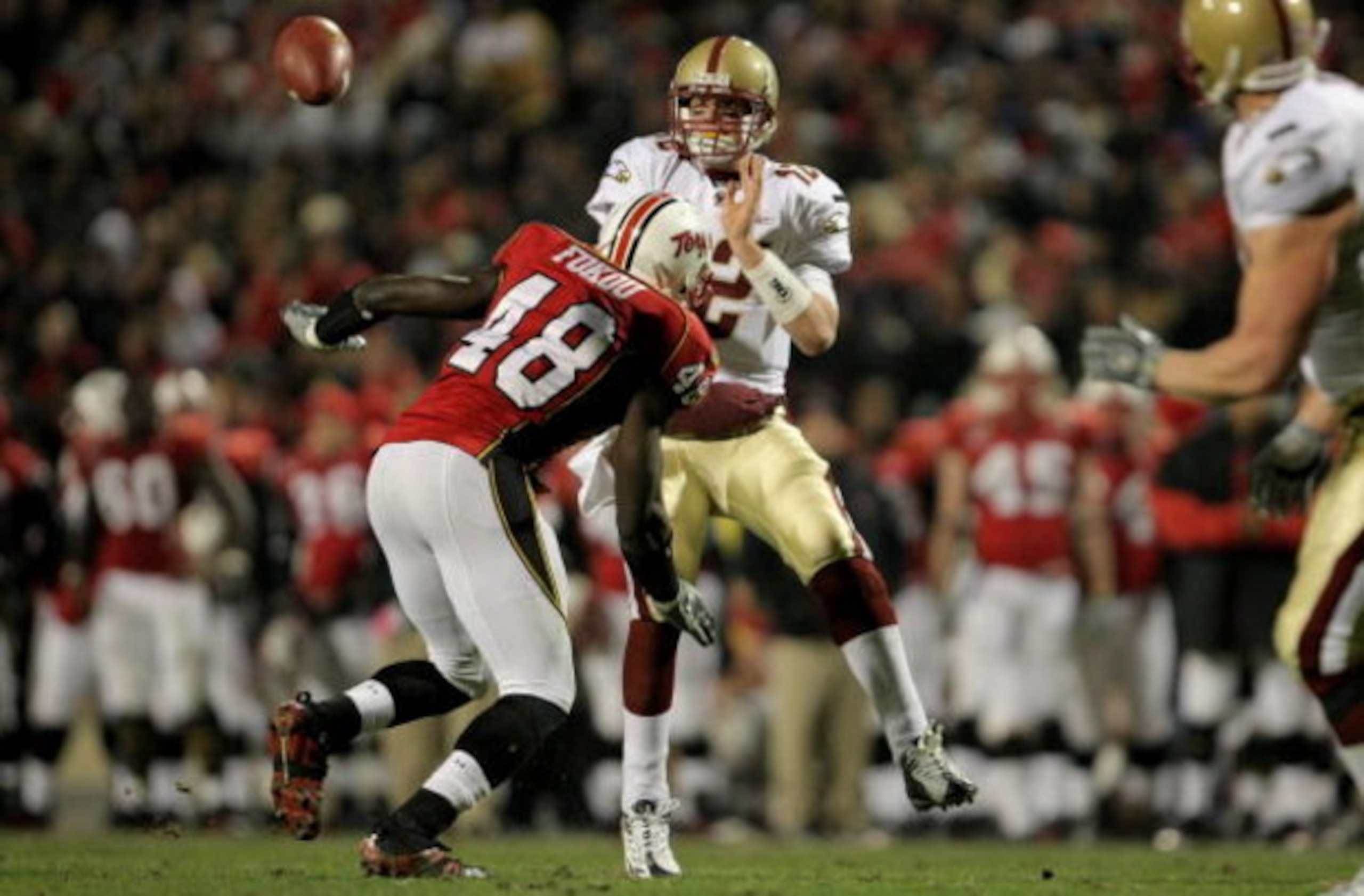 COLLEGE PARK, MD - NOVEMBER 10:  Quarterback Matt Ryan #12 of the Boston College Eagles delivers an incomplete pass as Moise Fokou #48 of the Maryland Terrapins provides pressure at Byrd Stadium on November 10, 2007 in College Park, Maryland.  (Photo by D