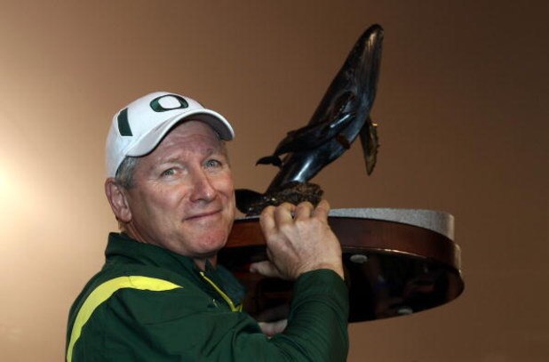 SAN DIEGO, CA - DECEMBER 30:   Head Coach Mike Bellotti of the University of Oregon Ducks holds the winner's trophy after beating the Oklahoma State University Cowboys in the Pacific Life Holiday Bowl at Qualcomm Stadium on December 30, 2008 in San Diego,
