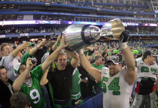 TORONTO - NOVEMBER 25:  Jeremy O'Day #54 of the Saskatchewan Rough Riders hoists the Grey Cup with fans in celebration of a 23-19 victory over the Winnipeg Blue Bombers during the 95th Grey Cup on November 25, 2007 at the Rogers Centre in Toronto, Ontario