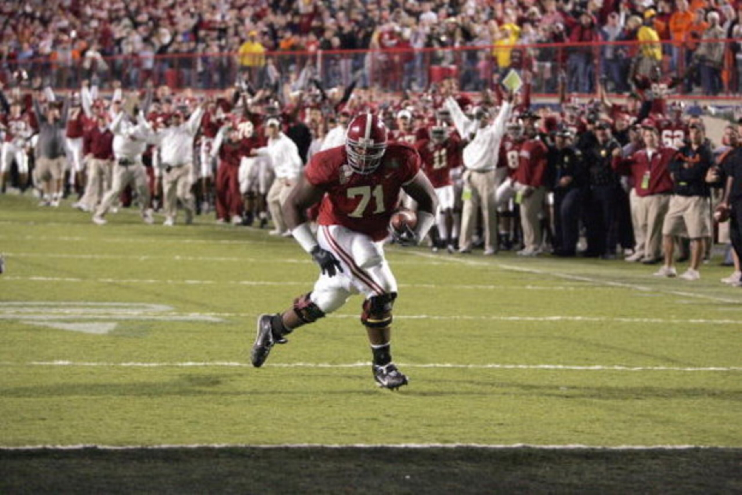 SHREVEPORT, LA - DECEMBER 28: Andre Smith #71 of Alabama runs in for a touchdown against Oklahoma State on December 28, 2006 during the PetroSun Independence Bowl at Independence Stadium in Shreveport, Louisiana. Oklahoma State defeated Alabama 34-31. SHREVEPORT, LA - DECEMBER 28: Andre Smith #71 of Alabama runs in for a touchdown against Oklahoma State on December 28, 2006 during the PetroSun Independence Bowl at Independence Stadium in Shreveport, Louisiana. Oklahoma State defeated Alabama 34-31.