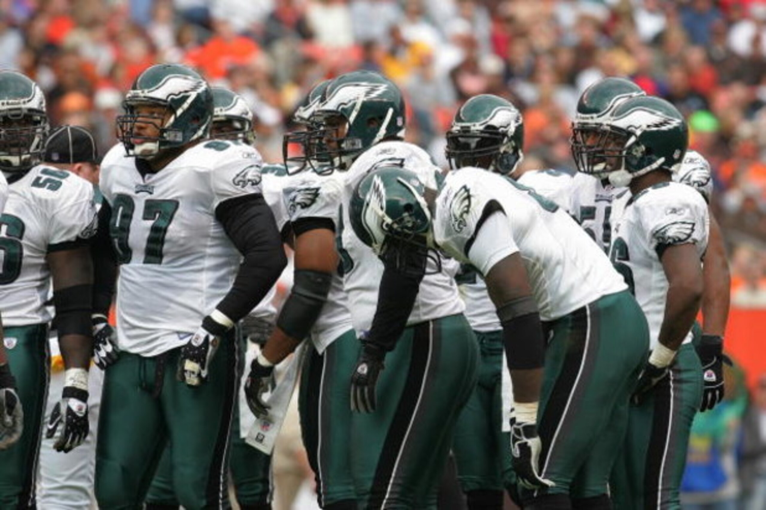 CLEVELAND - OCTOBER 24: The Philadelphia Eagles defensive unit talks with head coach Andy Reid during the game with the Cleveland Browns on October 24, 2004 at Cleveland Browns Stadium in Cleveland, Ohio. The Eagles defeated the Browns 34-31 in overtime. CLEVELAND - OCTOBER 24: The Philadelphia Eagles defensive unit talks with head coach Andy Reid during the game with the Cleveland Browns on October 24, 2004 at Cleveland Browns Stadium in Cleveland, Ohio. The Eagles defeated the Browns 34-31 in overtime.
