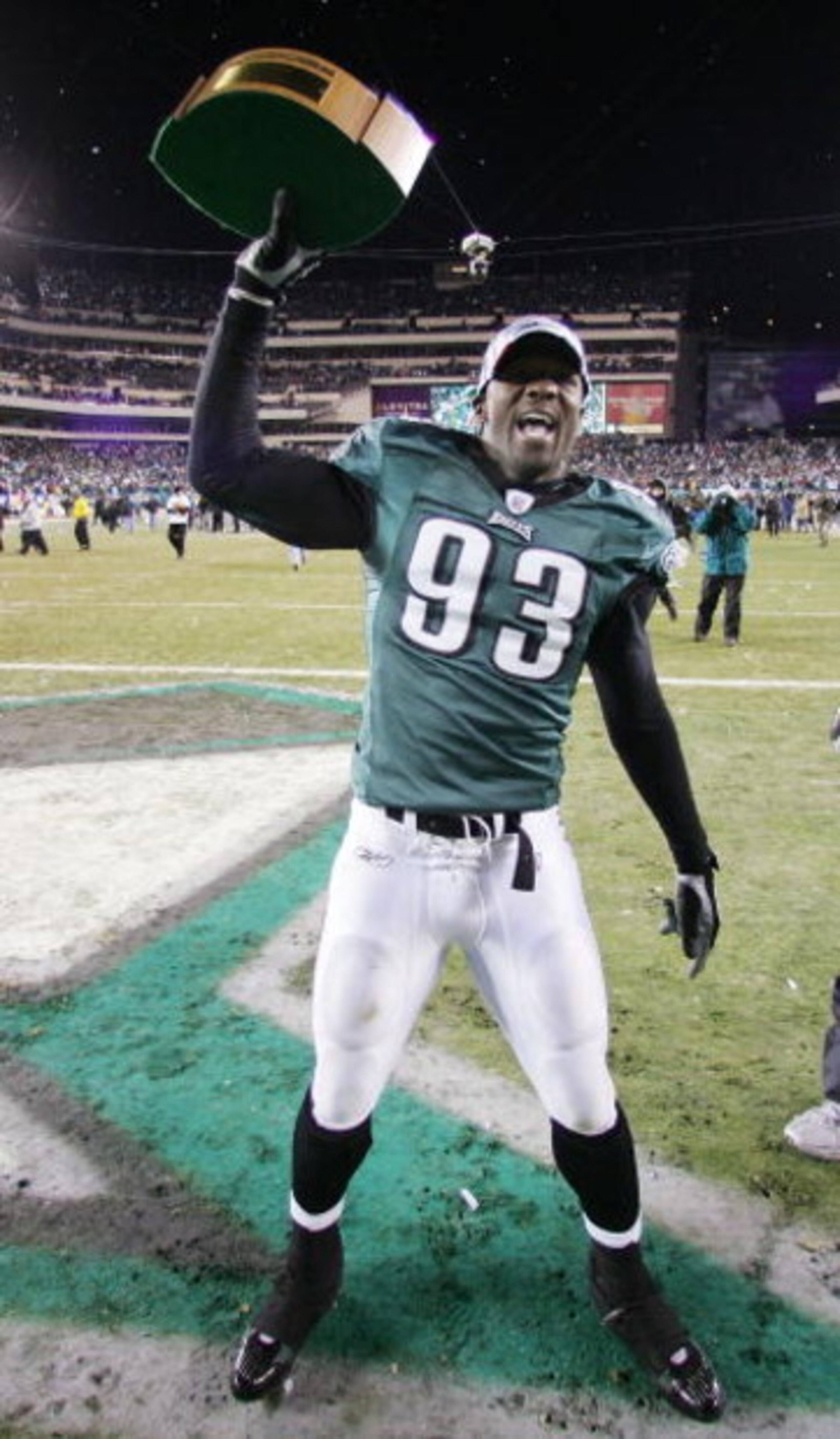 PHILADELPHIA - JANUARY 23: Defense end Jevon Kearse #93 of the Philadelphia Eagles celebrates with the George Halas NFC Championship trophy after defeating the Atlanta Falcons 27-10 in the NFC Championship game at Lincoln Financial Field on January 23, 2 PHILADELPHIA - JANUARY 23: Defense end Jevon Kearse #93 of the Philadelphia Eagles celebrates with the George Halas NFC Championship trophy after defeating the Atlanta Falcons 27-10 in the NFC Championship game at Lincoln Financial Field on January 23, 2