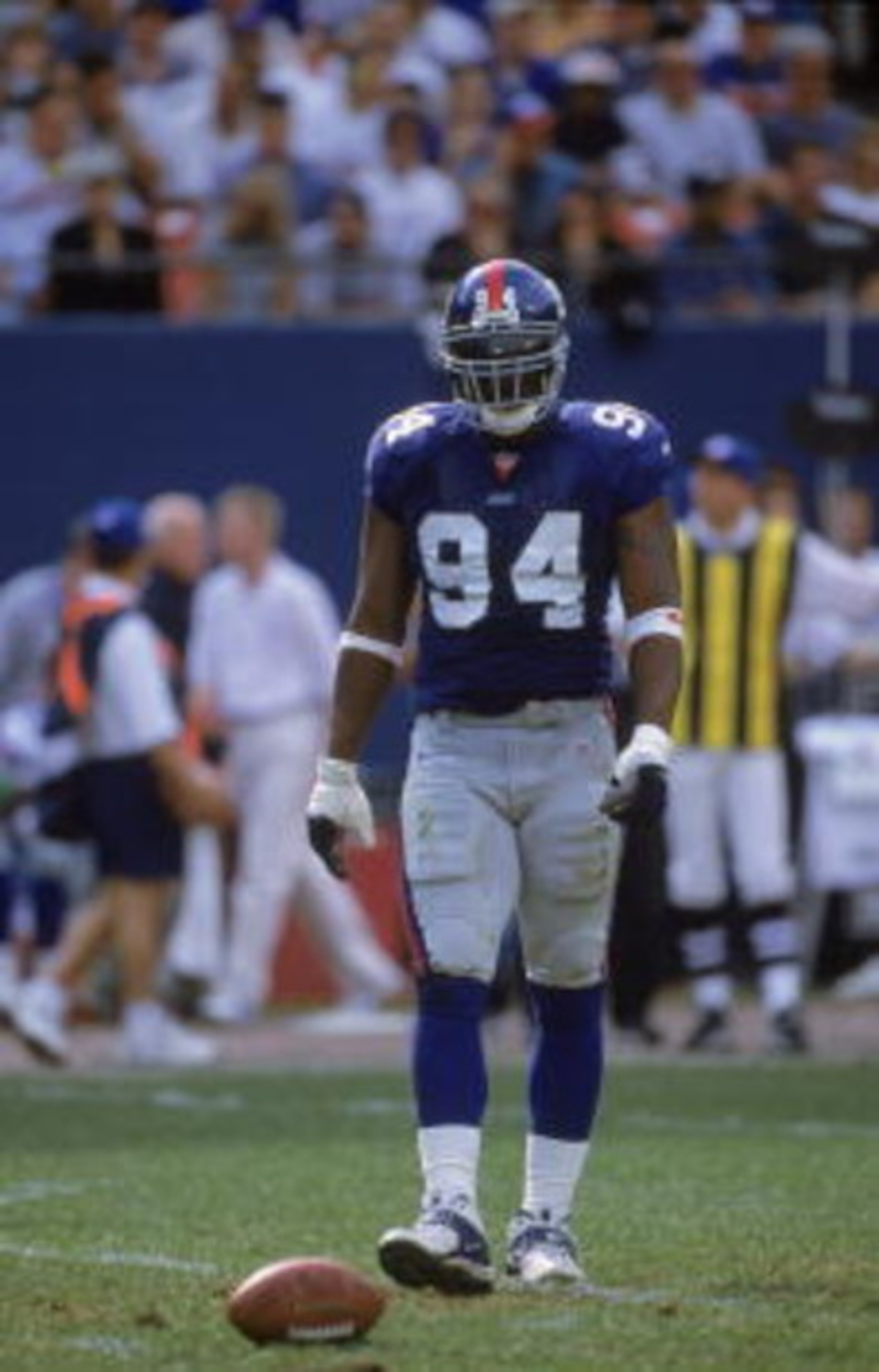 15 Oct 2000:  Cedric Jones #94 of the New York Giants walks on the field during the game against the Dallas Cowboys at the Giants Stadium in East Rutherford, New Jersey. The Giants defeated the Cowboys 19-14.Mandatory Credit: Harry How  /Allsport