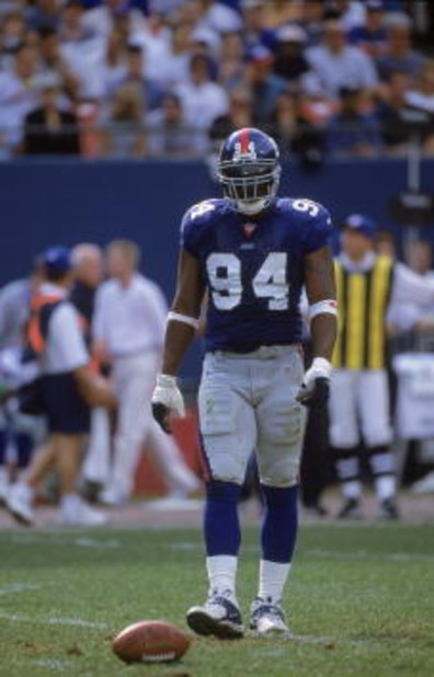 15 Oct 2000:  Cedric Jones #94 of the New York Giants walks on the field during the game against the Dallas Cowboys at the Giants Stadium in East Rutherford, New Jersey. The Giants defeated the Cowboys 19-14.Mandatory Credit: Harry How  /Allsport