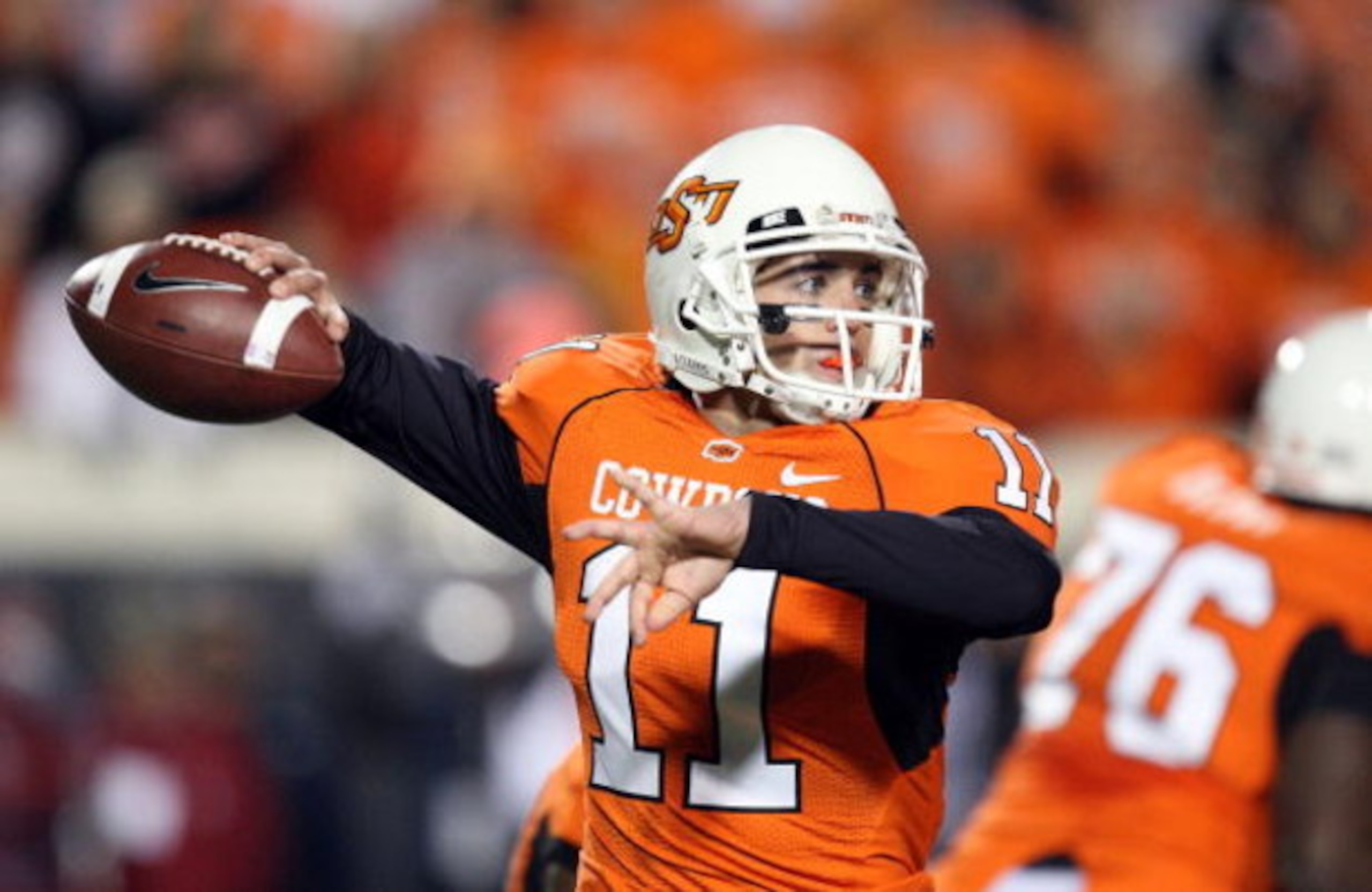 STILLWATER, OK - NOVEMBER 29:  Quarterback Zac Robinson #11 of the Oklahoma State Cowboys drops back to pass against the Oklahoma Sooners at Boone Pickens Stadium on November 29, 2008 in Stillwater, Oklahoma.  (Photo by Ronald Martinez/Getty Images)