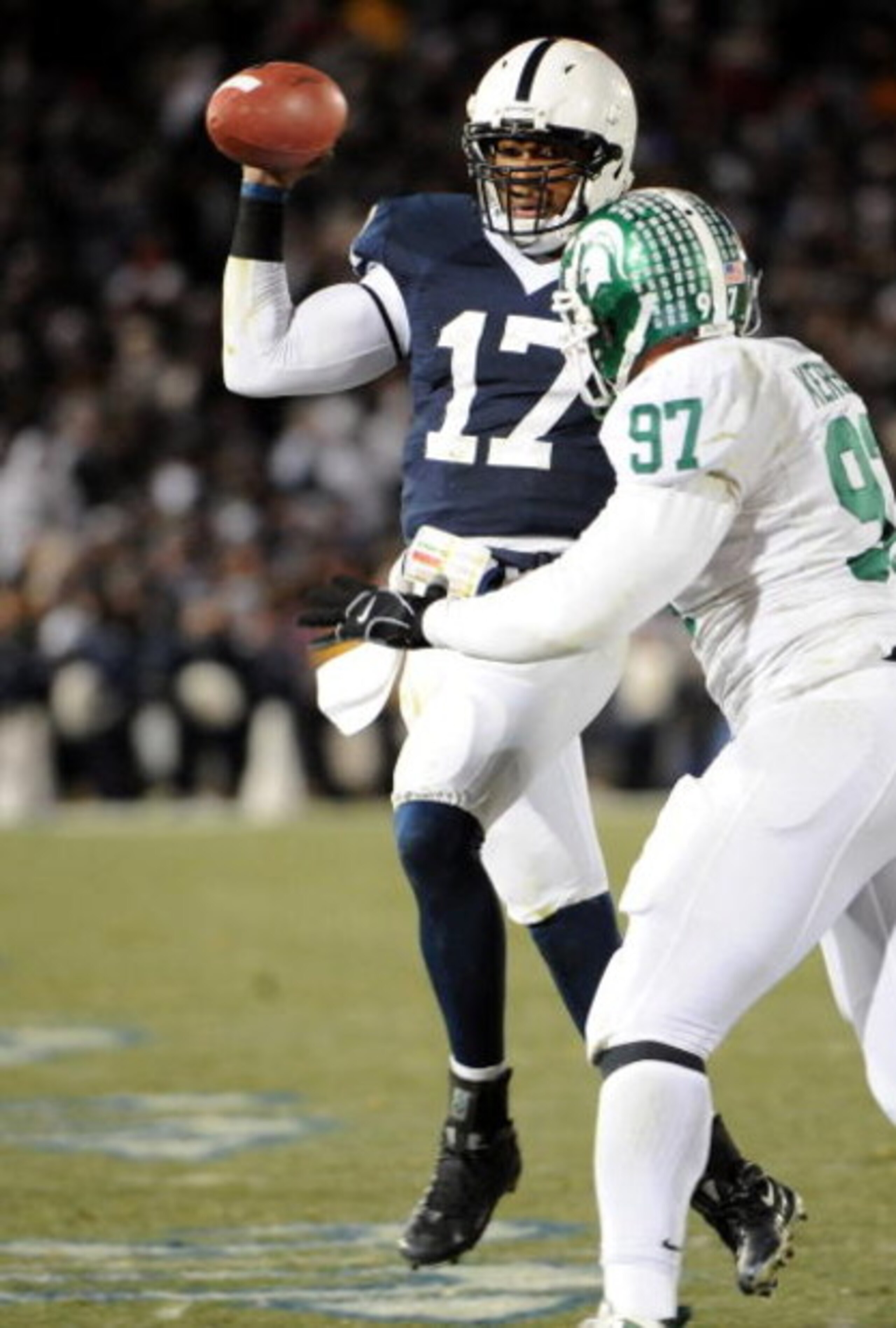 STATE COLLEGE, PA - NOVEMBER 22:  Darryl Clark #17 of the Penn State Nittany Lions scrambles in front of Justin Kershaw #97 of the Michigan State Spartans on November 22, 2008 at Beaver Stadium in State College, Pennsylvania. Penn State won the game 49-18