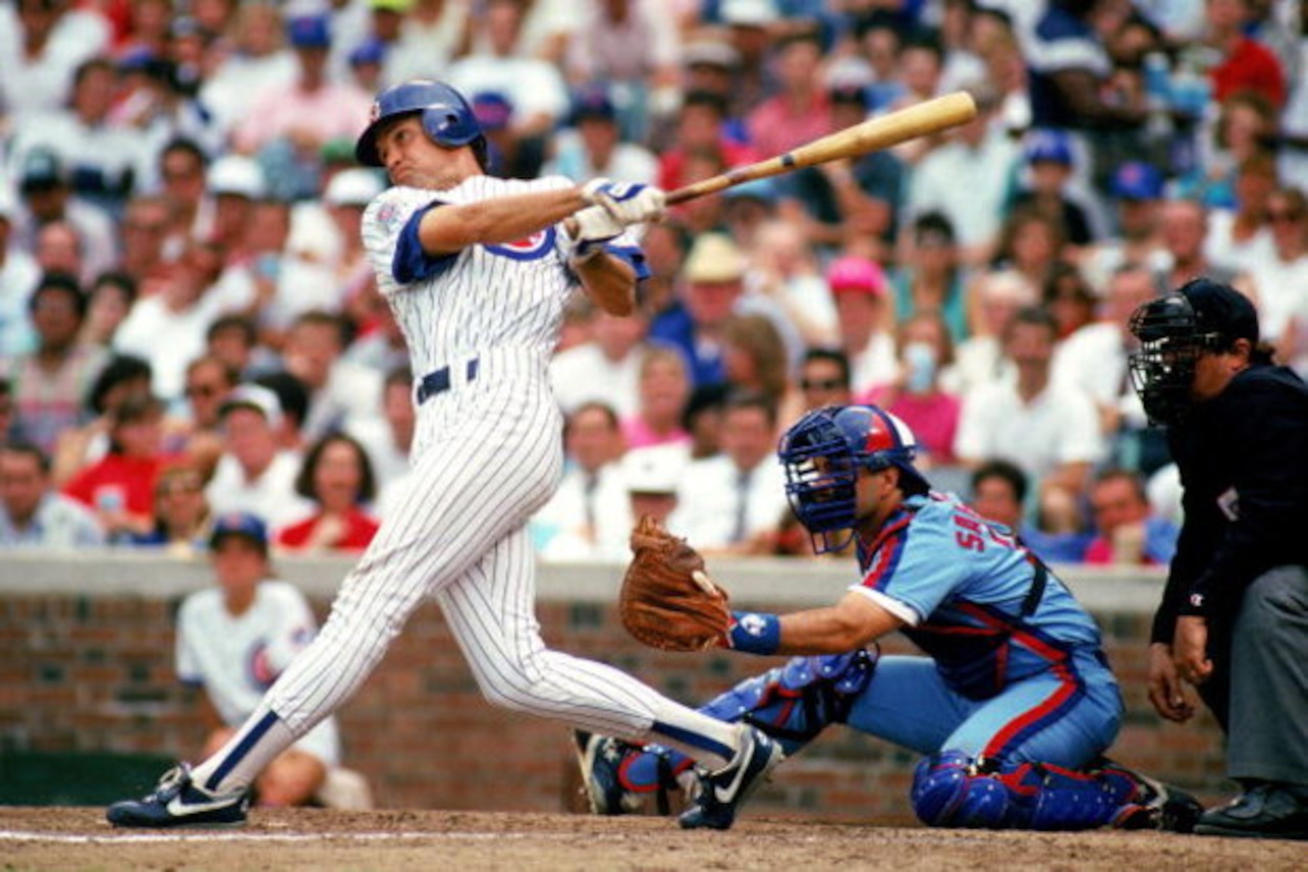 CHICAGO -1990: Ryne Sandberg #23 of the Chicago Cubs swings at the ball during a game against the Montreal Expos in 1990 at Wrigley Field in Chicago, Illinois. (Photo by Jonathan Daniel/Getty Images) CHICAGO -1990: Ryne Sandberg #23 of the Chicago Cubs swings at the ball during a game against the Montreal Expos in 1990 at Wrigley Field in Chicago, Illinois. (Photo by Jonathan Daniel/Getty Images)