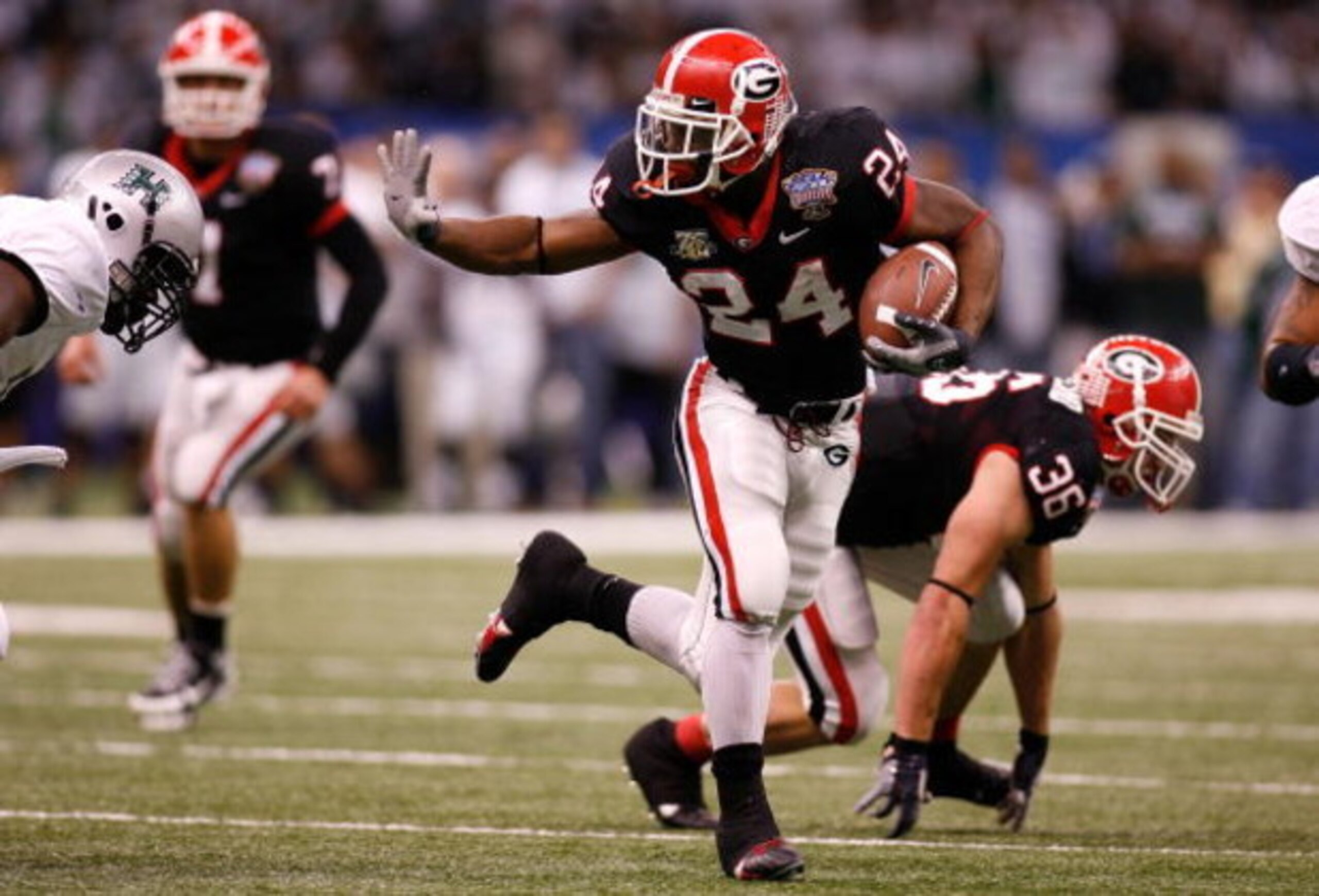 NEW ORLEANS - JANUARY 01:  Knowshon Moreno #24 of the Georgia Bulldogs runs the ball against the Hawai'i Warriors during the Allstate Sugar Bowl at the Louisiana Superdome on January 1, 2008 in New Orleans, Louisiana. Georgia won 41-10.  (Photo by Chris G