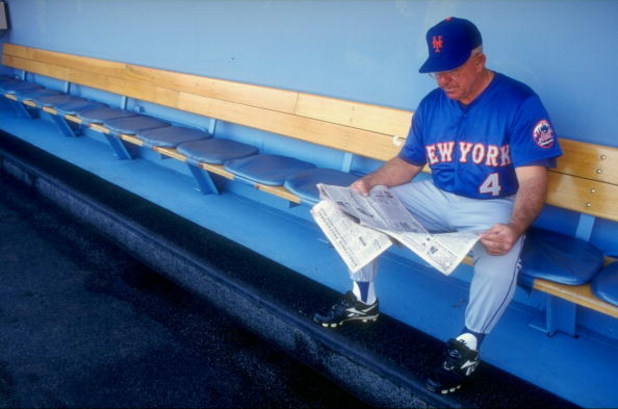 29 Aug 1998:  Coach Cookie Rojas #4 of the New York Mets reads a newspaper on the bench prior to a game against the Los Angeles Dodgers at Dodger Stadium in Los Angeles, California. The Mets defeated the Dodgers 4-3. Mandatory Credit: Donald Miralle  /All