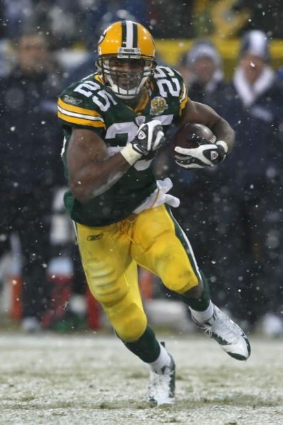 GREEN BAY, WI - JANUARY 12:  Running back Ryan Grant #25 of the Green Bay Packers runs the ball against the Seattle Seahawks during the NFC divisional playoff game on January 12, 2008 at Lambeau Field in Green Bay, Wisconsin. The Packers defeated the Seah