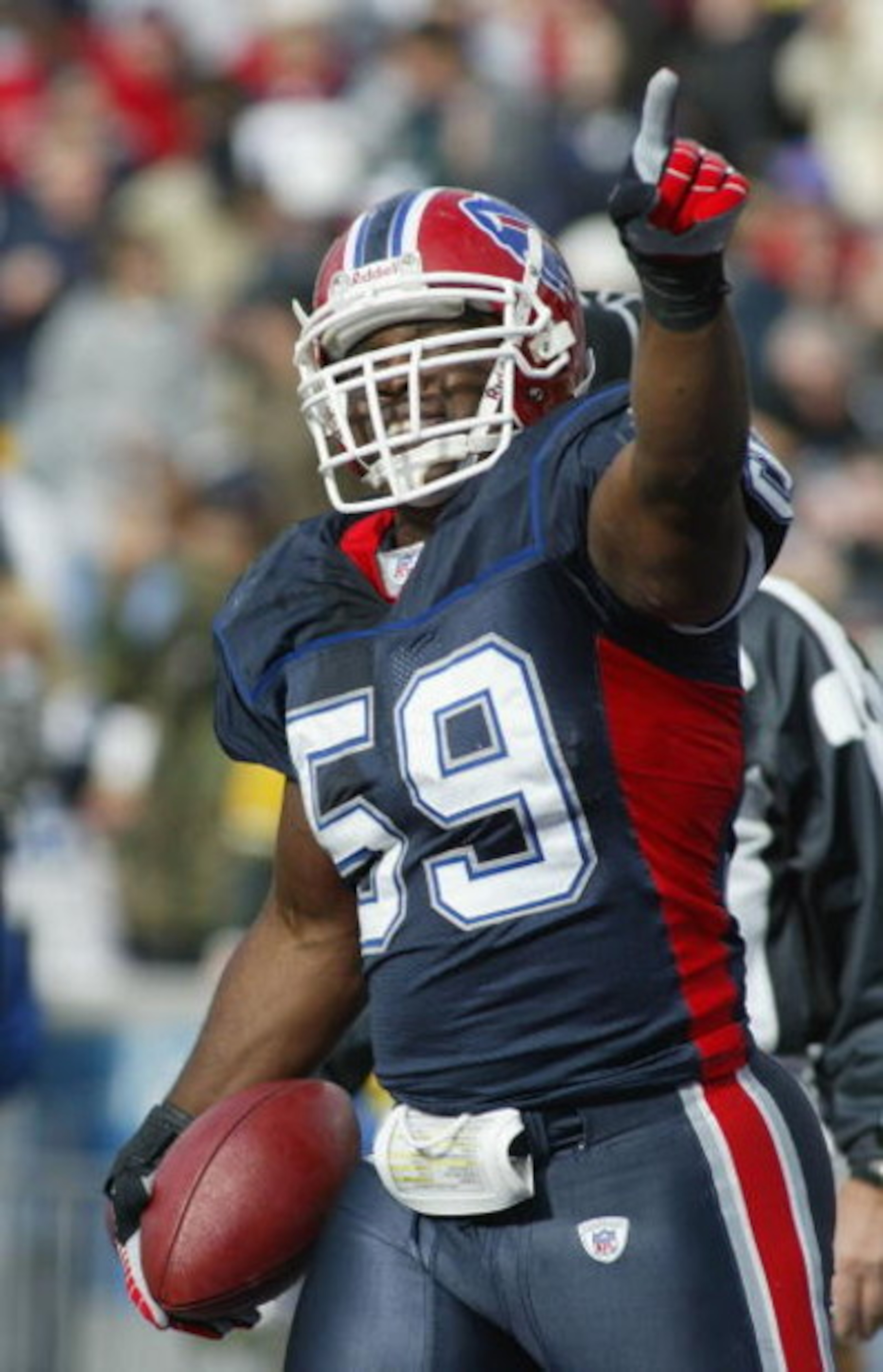 ORCHARD PARK, NY - NOVEMBER 05:  London Fletcher #59 of the Buffalo Bills celebrates his interception return for a touchdown against the Green Bay Packers on November 5, 2006 at Ralph Wilson Stadium in Orchard Park, New York.  (Photo by Rick Stewart/Getty