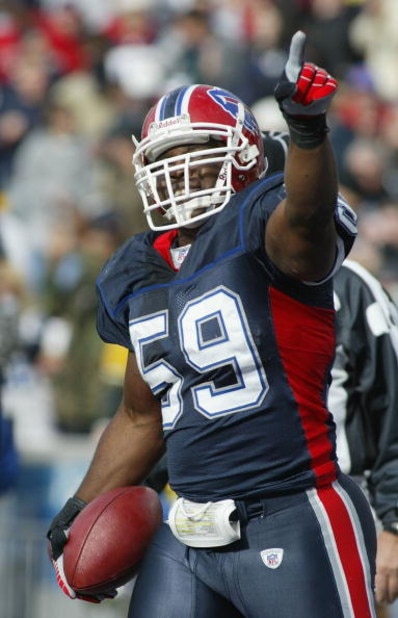 ORCHARD PARK, NY - NOVEMBER 05:  London Fletcher #59 of the Buffalo Bills celebrates his interception return for a touchdown against the Green Bay Packers on November 5, 2006 at Ralph Wilson Stadium in Orchard Park, New York.  (Photo by Rick Stewart/Getty