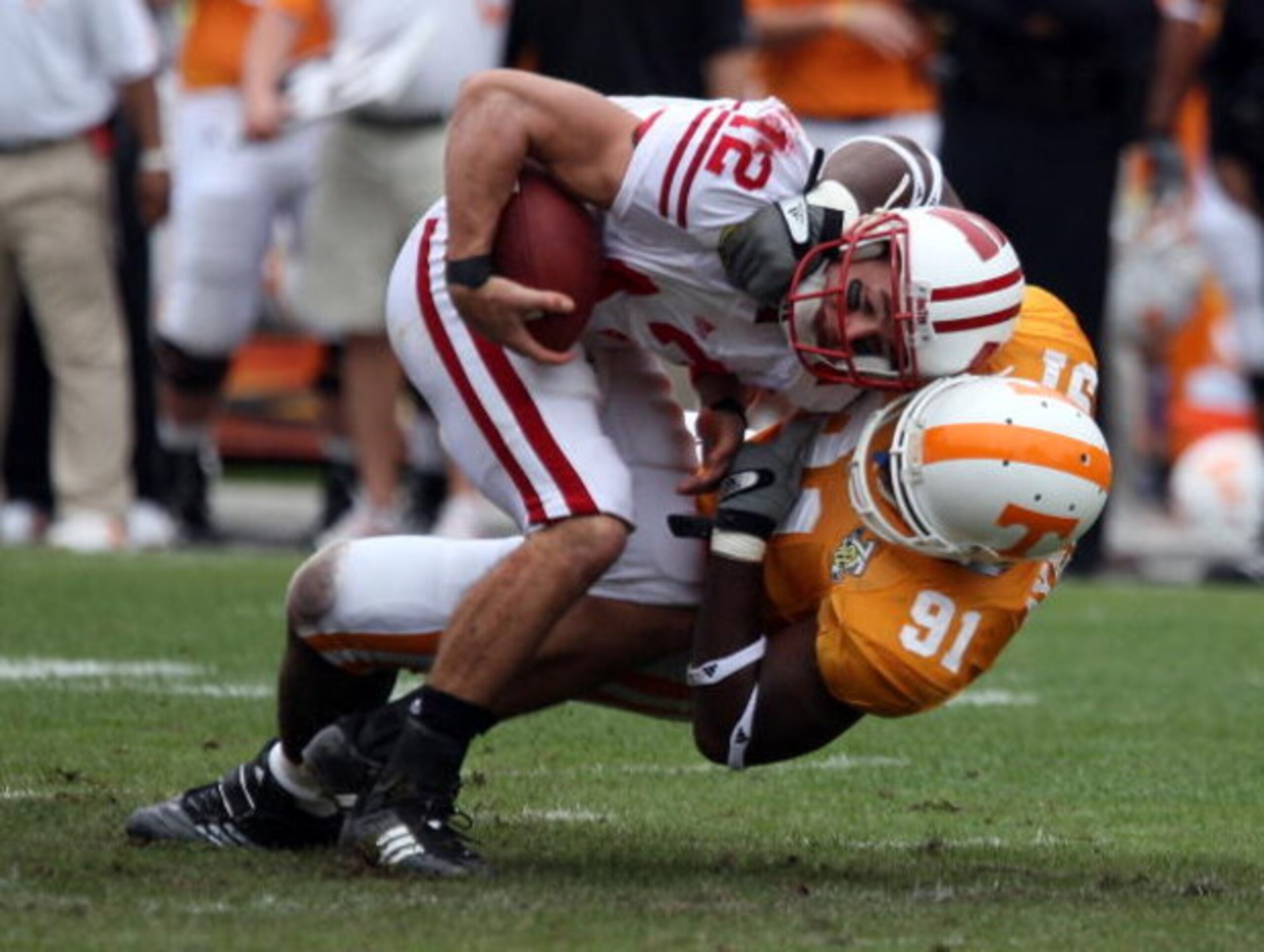 TAMPA, FL - JANUARY 01: Tyler Donovan #12 of the Wisconsin Badgers is sacked by Robert Ayers #91 of the Tennessee Volunteers during the Outback Bowl at Raymond James Stadium on January 1, 2008 in Tampa, Florida. (Photo by Scott Halleran/Getty Images) TAMPA, FL - JANUARY 01: Tyler Donovan #12 of the Wisconsin Badgers is sacked by Robert Ayers #91 of the Tennessee Volunteers during the Outback Bowl at Raymond James Stadium on January 1, 2008 in Tampa, Florida. (Photo by Scott Halleran/Getty Images)