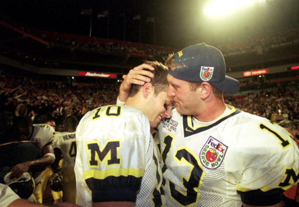 1 Jan 2000:  Tom Bradly and Jason Kapner of the Michigan Wolverines celebrate after winning the Orange Bowl Game against the Alabama Crimson Tide at the Pro Player Stadium in Miami, Florida. The Wolverines defeated the Crimson Tide 35-34. Mandatory Credit