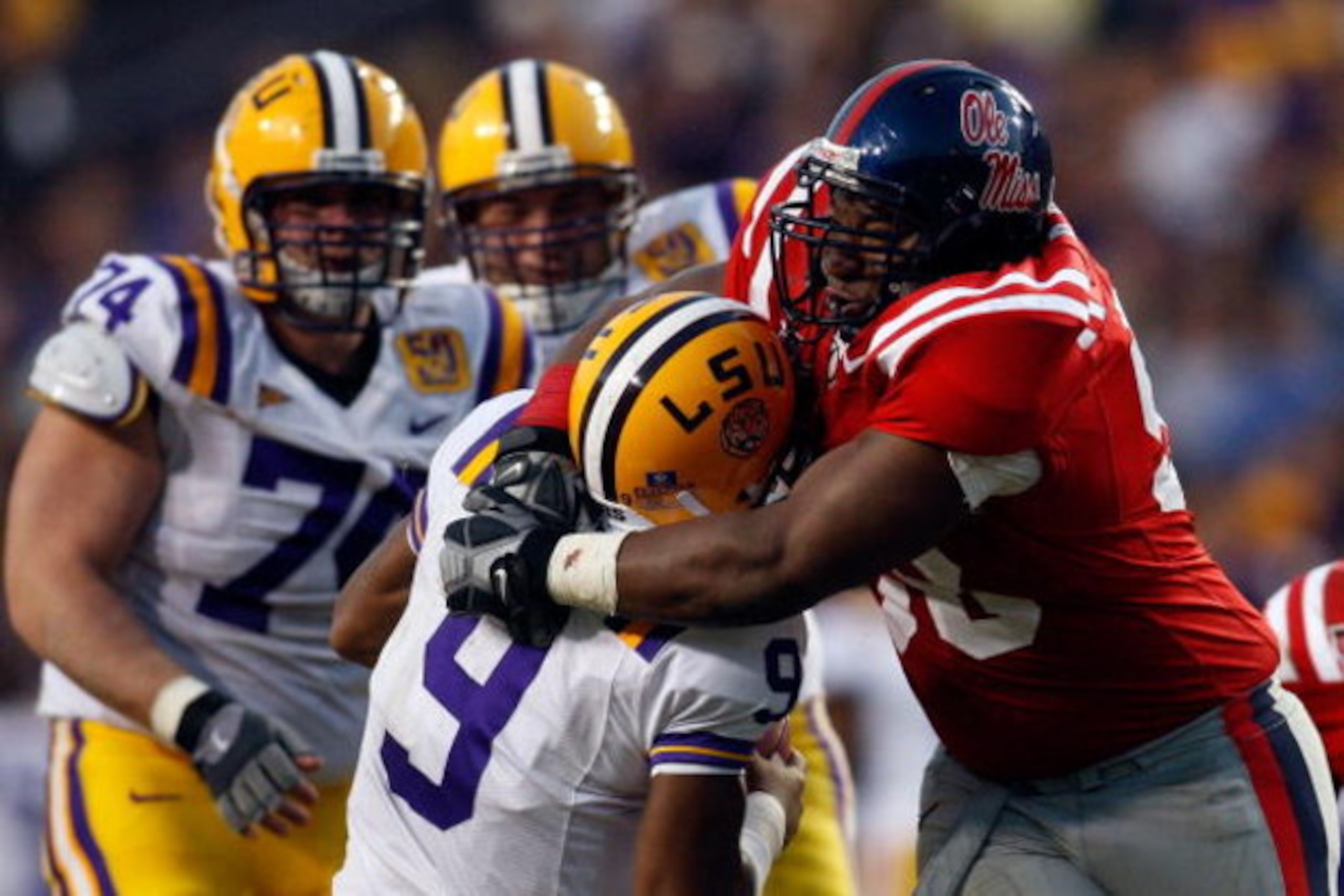BATON ROUGE, LA - NOVEMBER 22: Quarterback Jordan Jefferson #9 of the Louisiana State University Tigers is sacked by Peria Jerry #98 of the Ole Miss Rebels on November 22, 2008 at Tiger Stadium in Baton Rouge, Louisiana. The Rebels defeated the Tigers 3 BATON ROUGE, LA - NOVEMBER 22: Quarterback Jordan Jefferson #9 of the Louisiana State University Tigers is sacked by Peria Jerry #98 of the Ole Miss Rebels on November 22, 2008 at Tiger Stadium in Baton Rouge, Louisiana. The Rebels defeated the Tigers 3