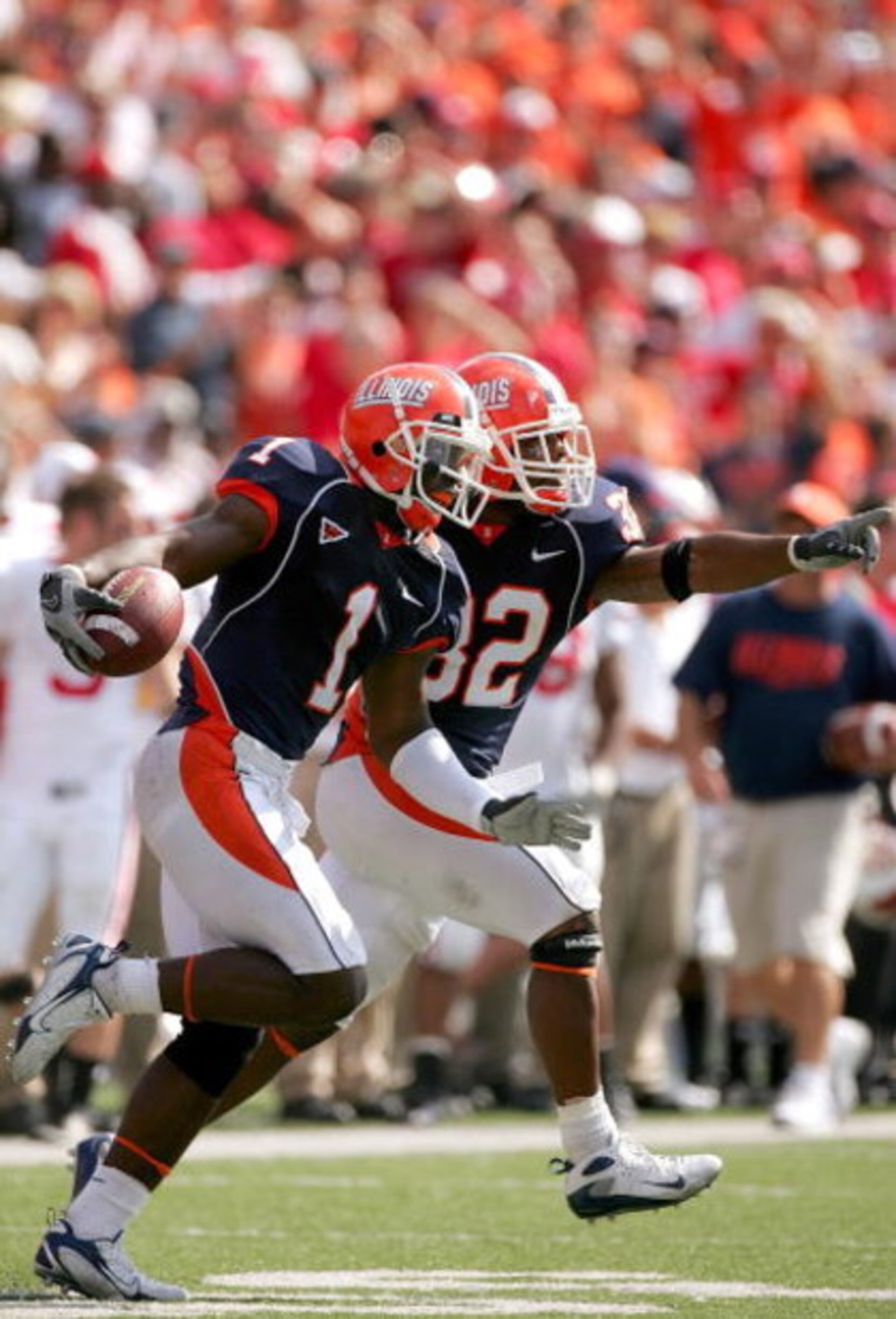 CHAMPAIGN, IL - OCTOBER 06: Vontae Davis #1 and Juston Harrison #32 of the Illinois Fighting Illini celebrate an interception against the Wisconsin Badgers October 6, 2007 at Memorial Stadium in Champaign, Illinois. (Photo by Matthew Stockman/Getty Imag CHAMPAIGN, IL - OCTOBER 06: Vontae Davis #1 and Juston Harrison #32 of the Illinois Fighting Illini celebrate an interception against the Wisconsin Badgers October 6, 2007 at Memorial Stadium in Champaign, Illinois. (Photo by Matthew Stockman/Getty Imag