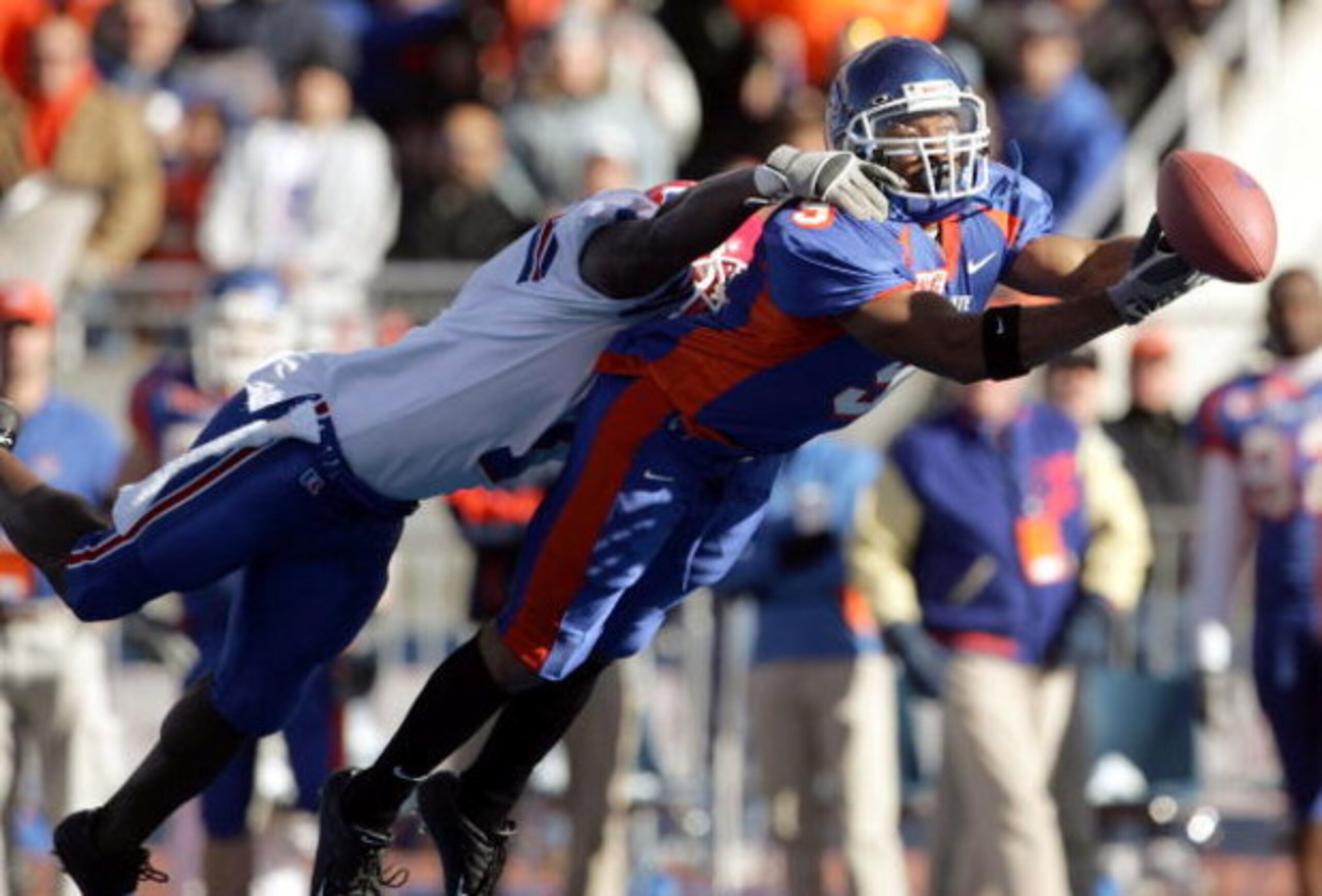 BOISE, ID - NOVEMBER 20:  Wide receiver Lawrence Bady #9 of Boise State has the ball slip through his hands while being covered by Corey Brazil #1 of Louisiana Tech during the first quarter at Bronco Stadium on November 20, 2004 in Boise, Idaho. Boise Sta