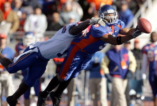 BOISE, ID - NOVEMBER 20:  Wide receiver Lawrence Bady #9 of Boise State has the ball slip through his hands while being covered by Corey Brazil #1 of Louisiana Tech during the first quarter at Bronco Stadium on November 20, 2004 in Boise, Idaho. Boise Sta
