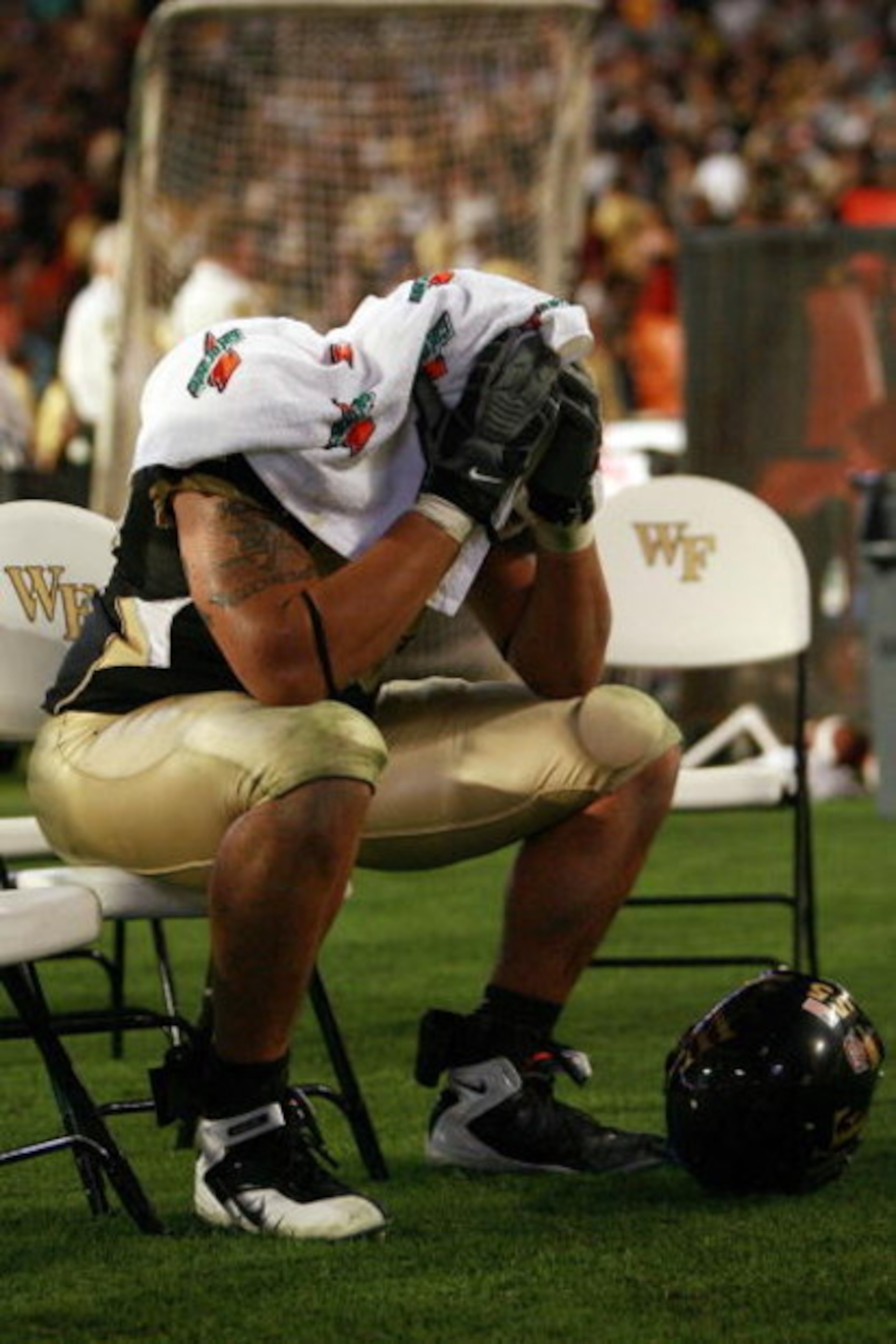 MIAMI GARDENS, FL - JANUARY 02:  Jyles Tucker #55 of the Wake Forest Demon Deacons sits on the sidelines after losing to the Louisville Cardinals during the 2007 FedEx Orange Bowl at Dolphin Stadium on January 2, 2007 in Miami Gardens, Florida.  (Photo by
