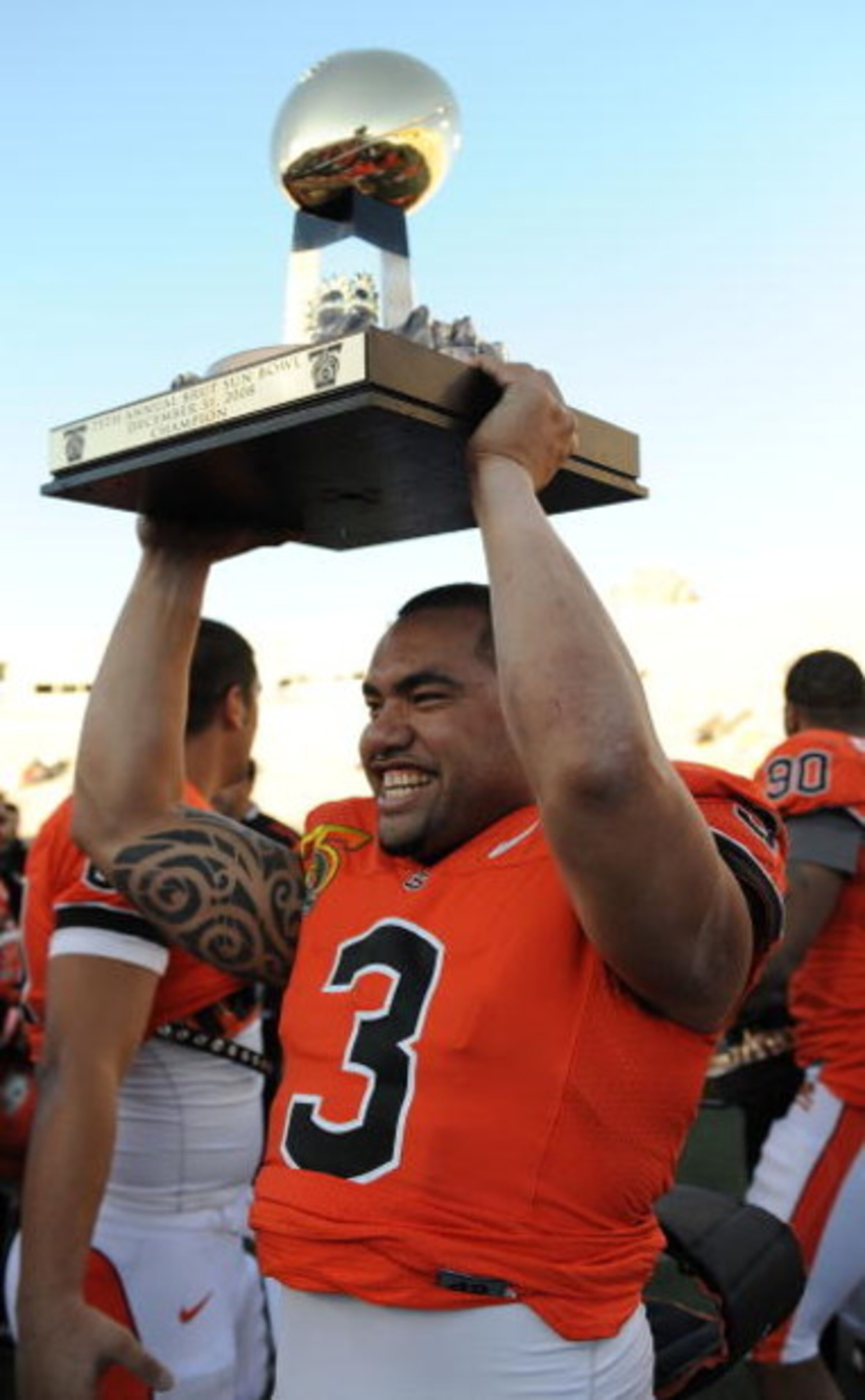 EL PASO, TX - DECEMBER 31:  Quarterback Lyle Moevao #3 of the Oregon State Beavers lifts the Sun Bowl trophy after a 3-0 win against the Pittsburgh Panthers during the Brut Sun Bowl at the Sun Bowl Stadium December 31, 2008 in El Paso, Texas.  (Photo by R