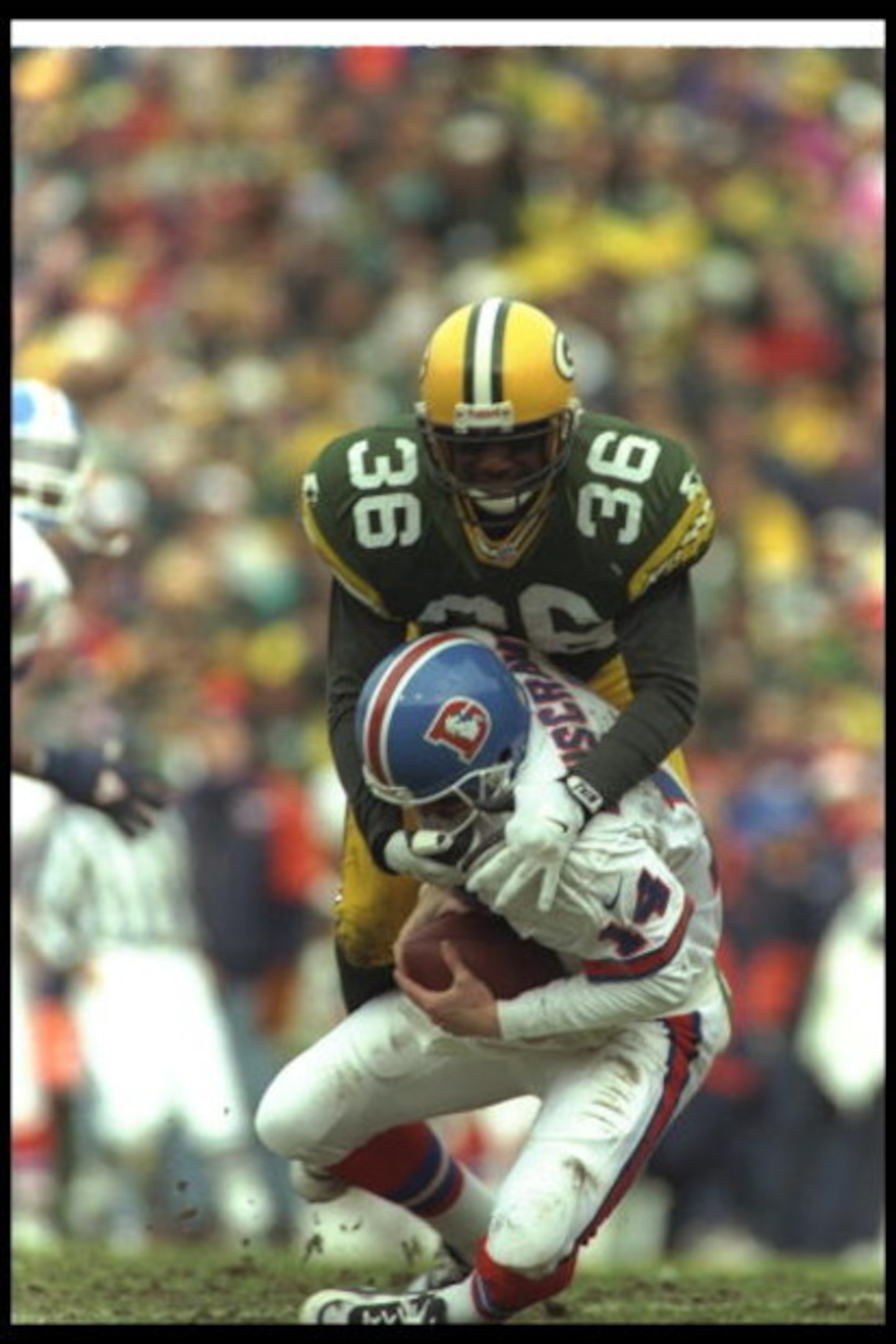 8 Dec 1996: Safety LeRoy Butler of the Green Bay Packers tackles Denver Broncos quarterback Bill Musgrave during a game at Lambeau Field in Green Bay, Wisconsin. The Packers won the game, 41-6. Mandatory Credit: Brian Bahr /Allsport 8 Dec 1996: Safety LeRoy Butler of the Green Bay Packers tackles Denver Broncos quarterback Bill Musgrave during a game at Lambeau Field in Green Bay, Wisconsin. The Packers won the game, 41-6. Mandatory Credit: Brian Bahr /Allsport