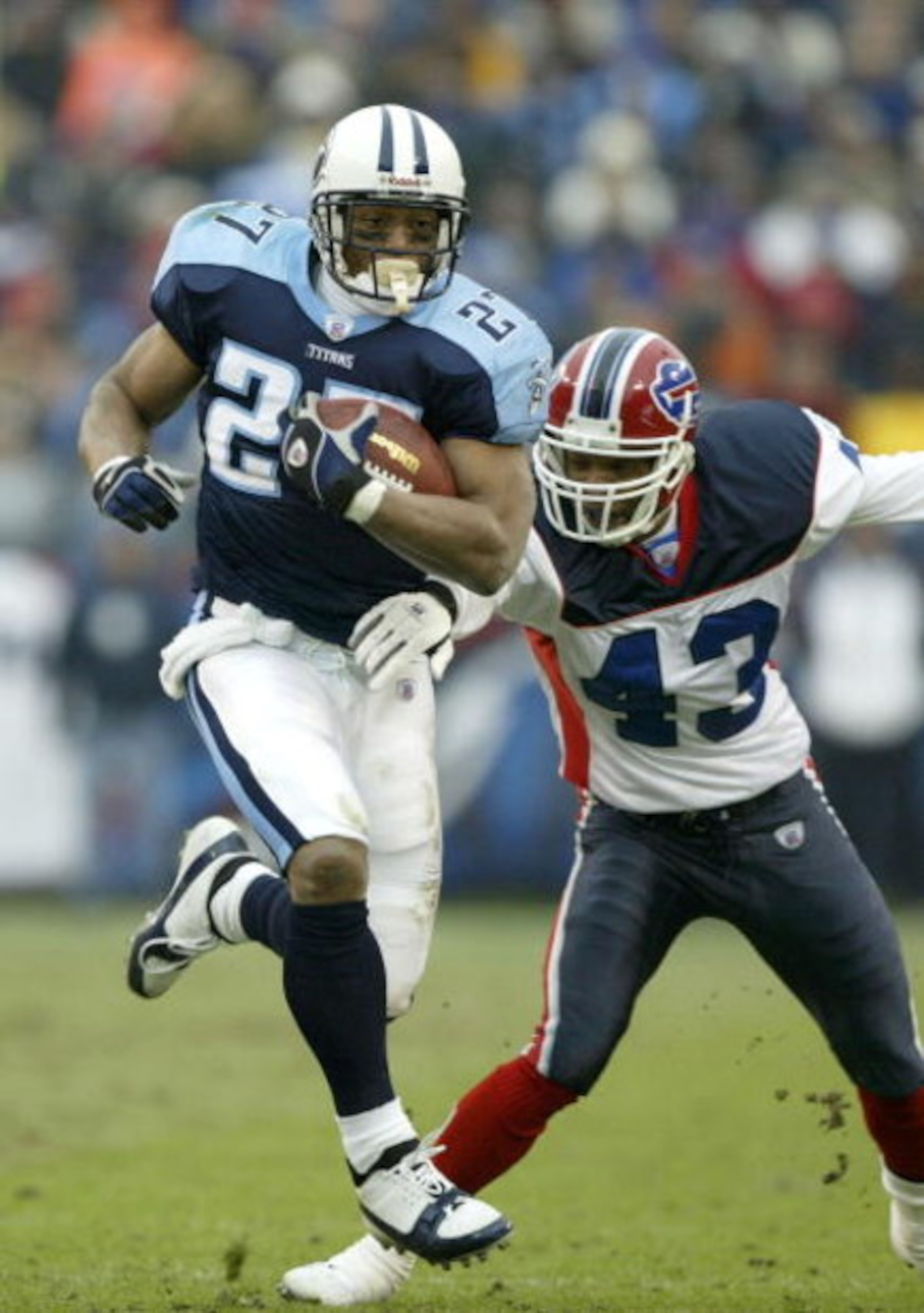 NASHVILLE, TN - DECEMBER 14: Eddie George #27 of the Tennessee Titans runs the ball as Izell Reese #43 of the Buffalo Bills tries to catch him in the first half on December 14, 2003 at the Coliseum in Nashville, Tennessee. (Photo by Robert Laberge/Getty NASHVILLE, TN - DECEMBER 14: Eddie George #27 of the Tennessee Titans runs the ball as Izell Reese #43 of the Buffalo Bills tries to catch him in the first half on December 14, 2003 at the Coliseum in Nashville, Tennessee. (Photo by Robert Laberge/Getty