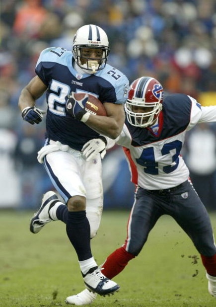 NASHVILLE, TN - DECEMBER 14:  Eddie George #27 of the Tennessee Titans runs the ball as Izell Reese #43 of the Buffalo Bills tries to catch him in the first half on December 14, 2003 at the Coliseum in Nashville, Tennessee.  (Photo by Robert Laberge/Getty