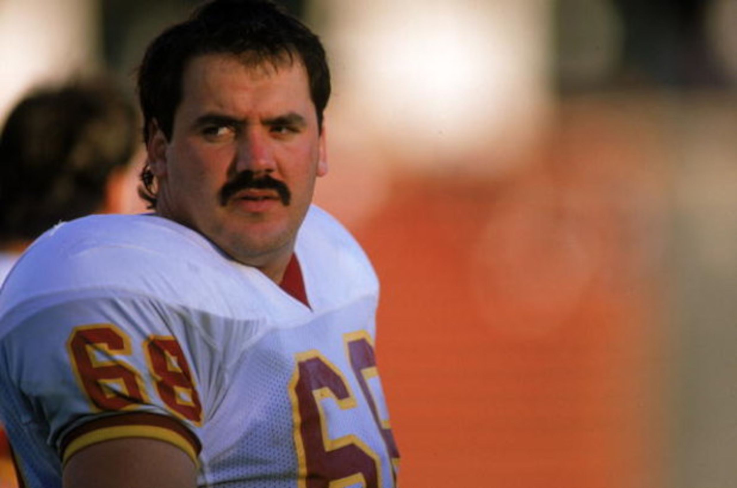 LOS ANGELES - OCTOBER 29: Offensive linebacker Russ Grimm #68 of the Washington Redskins sits on the sideline during a game against the Los Angeles Raiders on October 29, 1989 at the Memorial Coliseum in Los Angeles, California. The Raiders won 37-24. (P LOS ANGELES - OCTOBER 29: Offensive linebacker Russ Grimm #68 of the Washington Redskins sits on the sideline during a game against the Los Angeles Raiders on October 29, 1989 at the Memorial Coliseum in Los Angeles, California. The Raiders won 37-24. (P