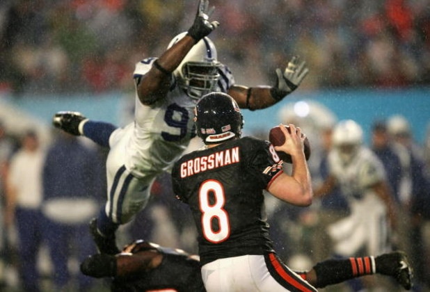 MIAMI GARDENS, FL - FEBRUARY 04:  Quaterback Rex Grossman #8 of the Chicago Bears drops back to pass as Robert Mathis #98 of the Indianapolis Colts dives in during Super Bowl XLI on February 4, 2007 at Dolphin Stadium in Miami Gardens, Florida. The Colts 
