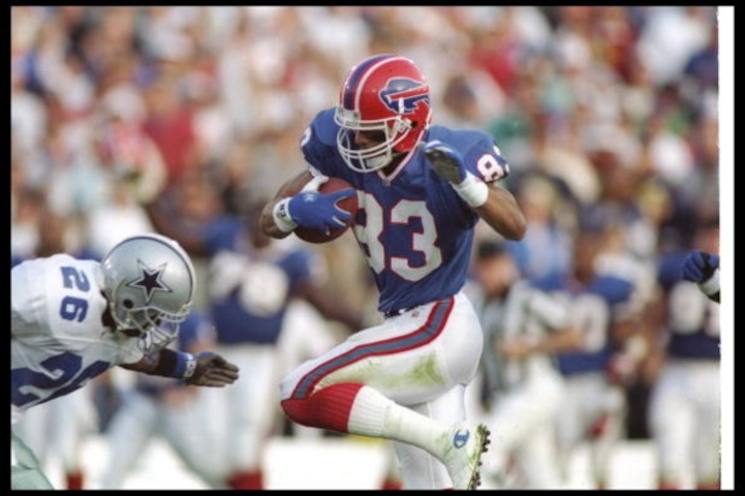 31 Jan 1993:  Wide receiver Andre Reed of the Buffalo Bills moves the ball during Super Bowl XXVII against the Dallas Cowboys at the Rose Bowl in Pasadena, California.  The Cowboys won the game, 52-17. Mandatory Credit: Rick Stewart  /Allsport