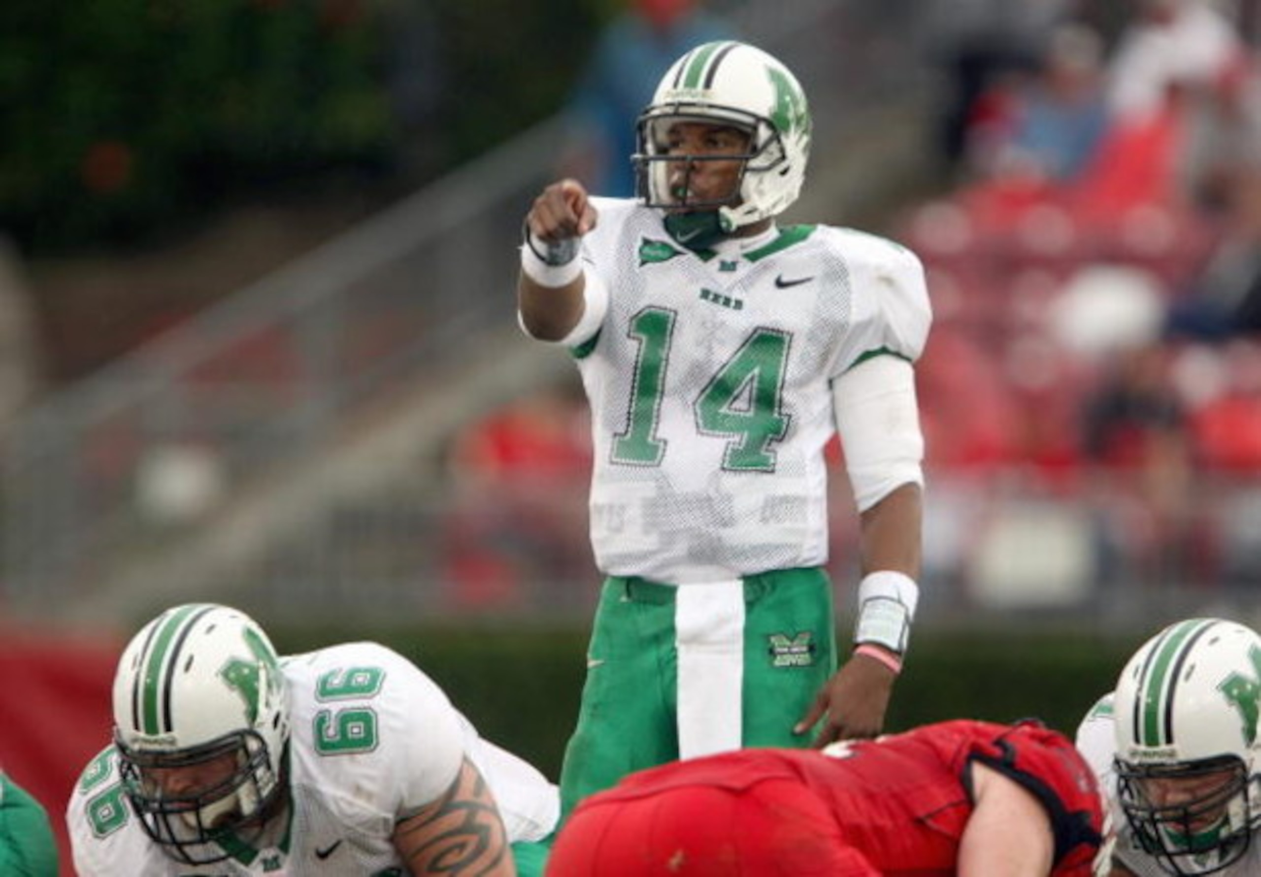 HOUSTON - NOVEMBER 17: Bernard Morris #14 of the Marshall Thundering Herd calls the play during the game with the Houston Cougars at Robertson Stadium November 17, 2007 in Houston, Texas. Houston won 35-28. (Photo by Stephen Dunn/Getty Images) HOUSTON - NOVEMBER 17: Bernard Morris #14 of the Marshall Thundering Herd calls the play during the game with the Houston Cougars at Robertson Stadium November 17, 2007 in Houston, Texas. Houston won 35-28. (Photo by Stephen Dunn/Getty Images)