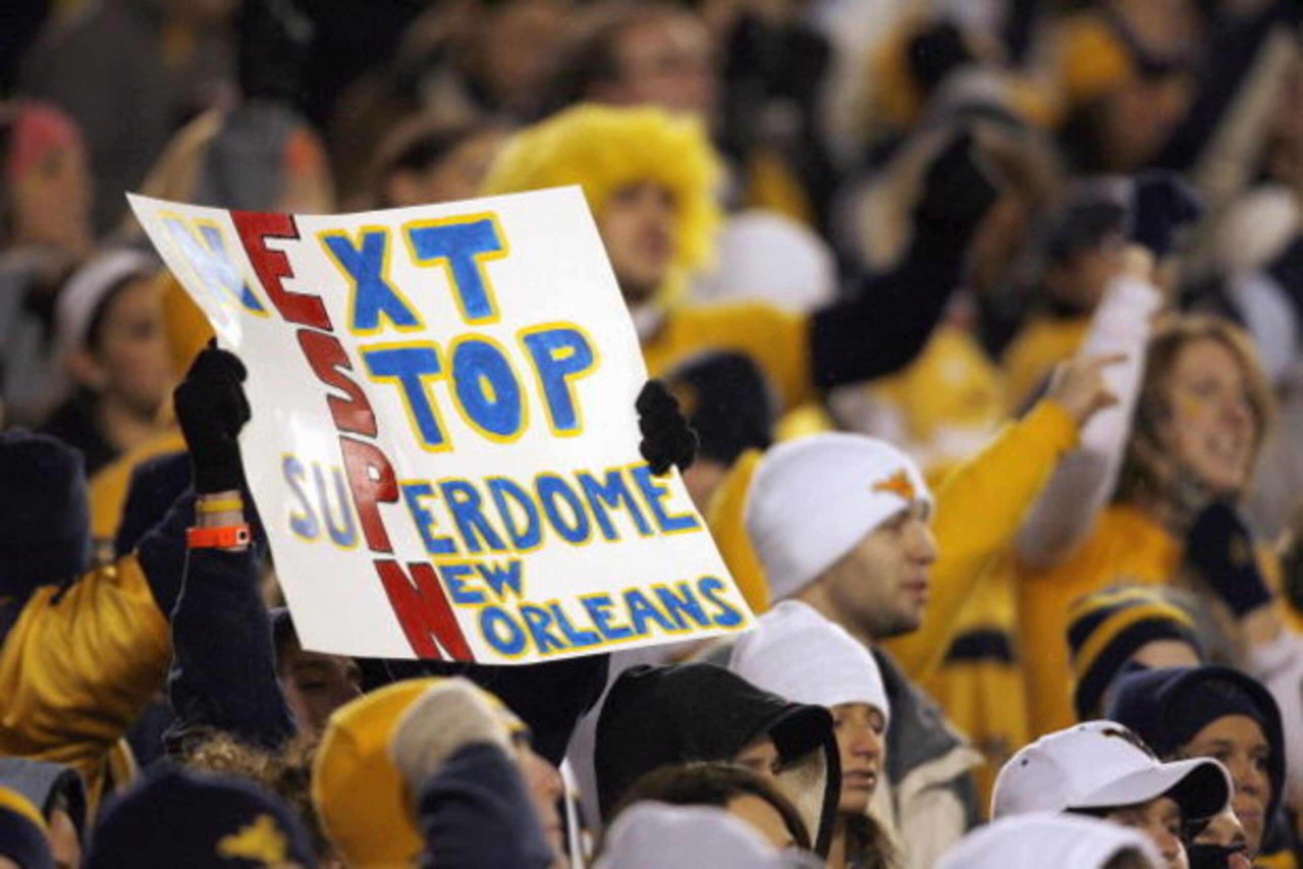 MORGANTOWN, WV - DECEMBER 1: A fan of the West Virginia Mountaineers holds up a ESPN sign during the game against the Pittsburgh Panthers at Milan Puskar Stadium on December 1, 2007 in Morgantown, West Virginia. (Photo by Kevin C. Cox/Getty Images) MORGANTOWN, WV - DECEMBER 1: A fan of the West Virginia Mountaineers holds up a ESPN sign during the game against the Pittsburgh Panthers at Milan Puskar Stadium on December 1, 2007 in Morgantown, West Virginia. (Photo by Kevin C. Cox/Getty Images)