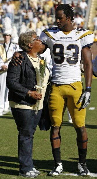 ATLANTA - NOVEMBER 1:  Defensive end Michael Johnson #93 of the Georgia Tech Yellow Jackets talks with his mother Thomasene during Senior Day festivities before the game between the Florida State Seminoles and the Georgia Tech Yellow Jackets at Bobby Dodd