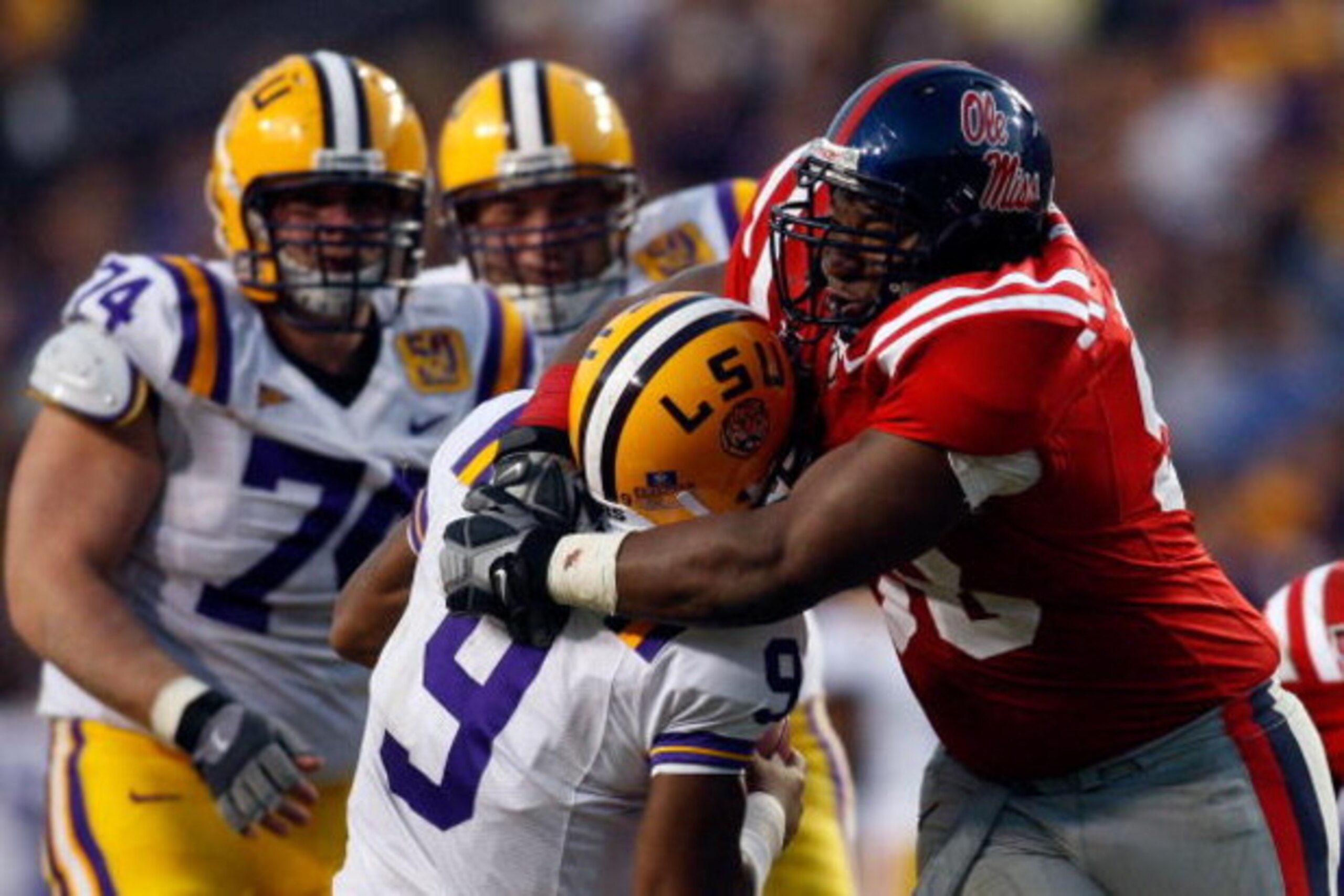 BATON ROUGE, LA - NOVEMBER 22: Quarterback Jordan Jefferson #9 of the Louisiana State University Tigers is sacked by Peria Jerry #98 of the Ole Miss Rebels on November 22, 2008 at Tiger Stadium in Baton Rouge, Louisiana. The Rebels defeated the Tigers 3 BATON ROUGE, LA - NOVEMBER 22: Quarterback Jordan Jefferson #9 of the Louisiana State University Tigers is sacked by Peria Jerry #98 of the Ole Miss Rebels on November 22, 2008 at Tiger Stadium in Baton Rouge, Louisiana. The Rebels defeated the Tigers 3