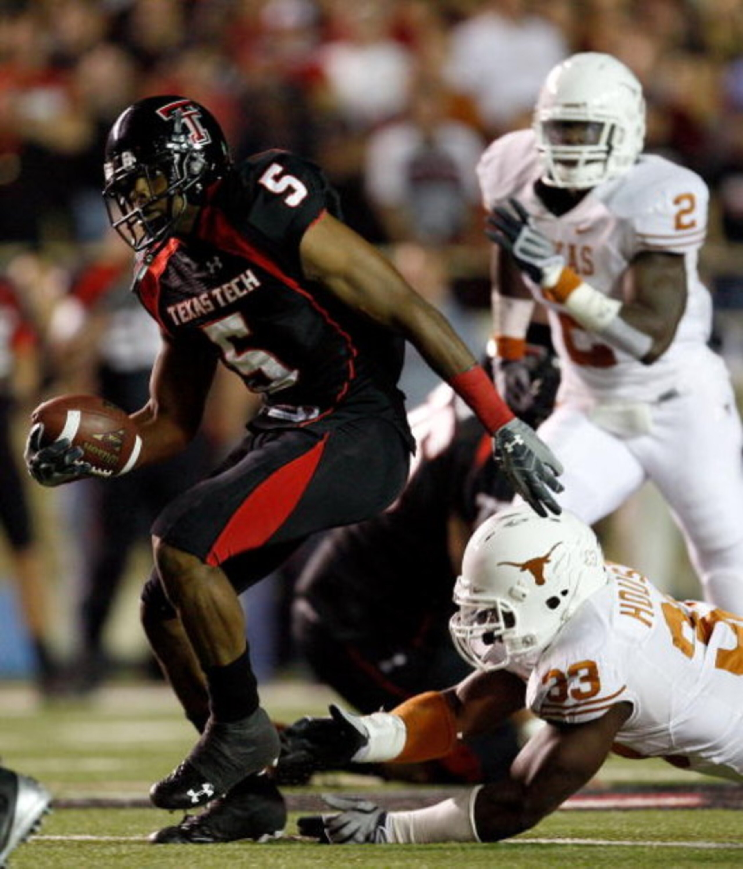 LUBBOCK, TX - NOVEMBER 01: Michael Crabtree #5 of the Texas Tech Red Raiders carries the ball after making a reception during the first half of the game against the Texas Longhorns on November 1, 2008 at Jones Stadium in Lubbock, Texas. (Photo by Jamie LUBBOCK, TX - NOVEMBER 01: Michael Crabtree #5 of the Texas Tech Red Raiders carries the ball after making a reception during the first half of the game against the Texas Longhorns on November 1, 2008 at Jones Stadium in Lubbock, Texas. (Photo by Jamie