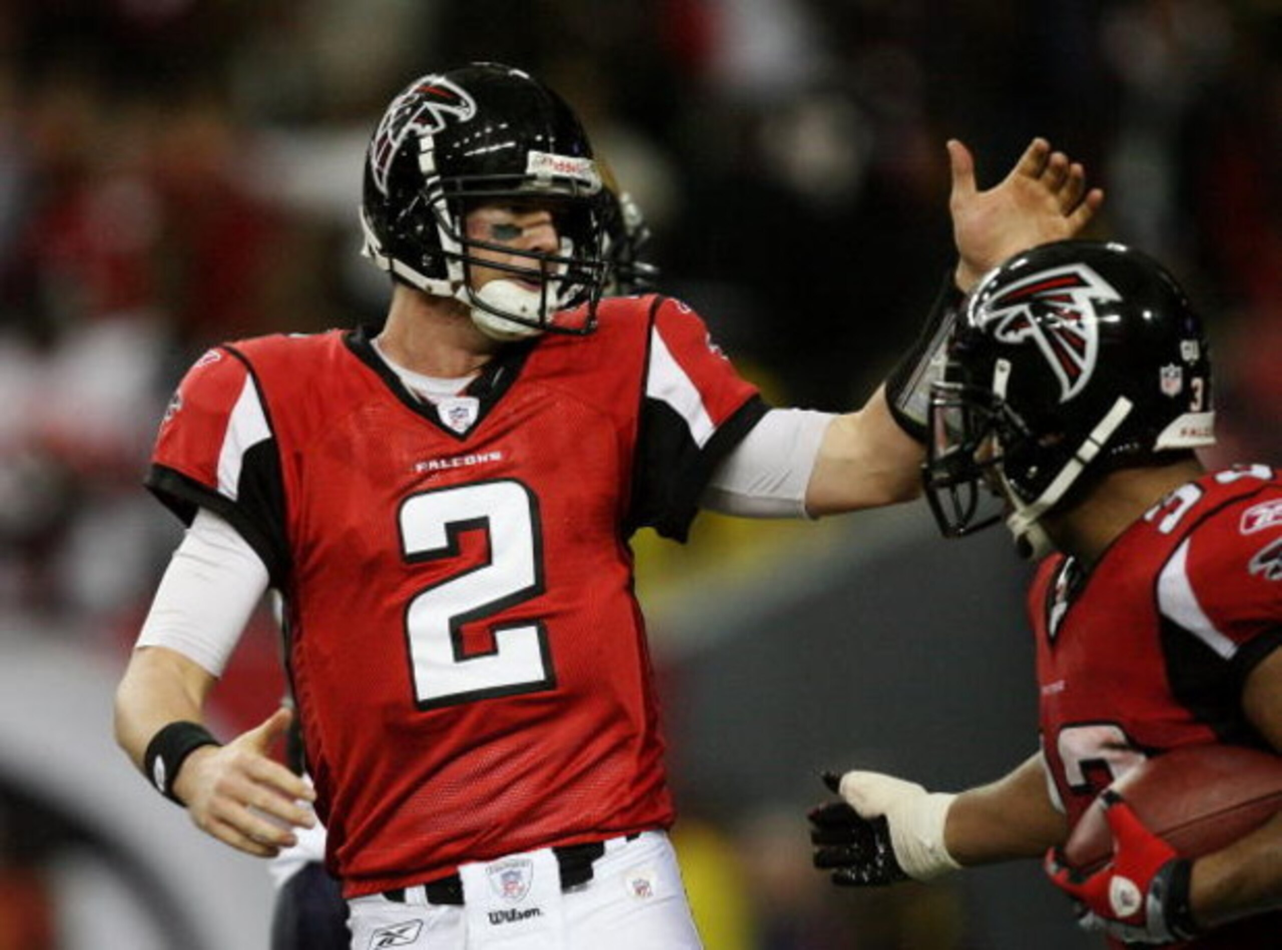 ATLANTA - DECEMBER 28:  Quarterback Matt Ryan #2 of the Atlanta Falcons celebrates with running back Michael Turner #33 after Turner scored a touchdown against the St. Louis Rams at Georgia Dome on December 28, 2008 in Atlanta, Georgia.  (Photo by Doug Be