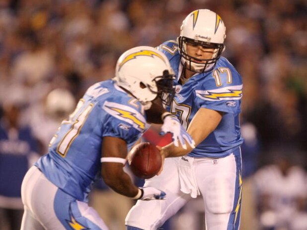 SAN DIEGO - JANUARY 03:  Philip Rivers #17 of the San Diego Chargers hands off the ball to LaDainian Tomlinson #21 during their game against the Indianapolis Colts in the AFC Wild Card Game on January 3, 2009 at Qualcomm Stadium in San Diego, California. 