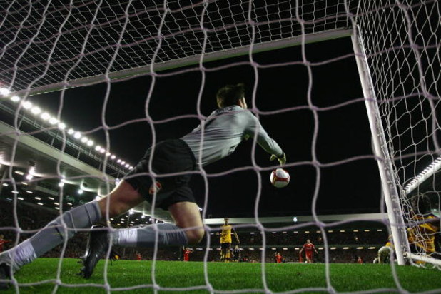 LIVERPOOL, UNITED KINGDOM - APRIL 21:  Lukasz Fabianski of Arsenal punches clear as Yossi Benayoun of Liverpool scores his team's second goal during the Barclays Premier League match between Liverpool and Arsenal at Anfield on April 21, 2009 in Liverpool,
