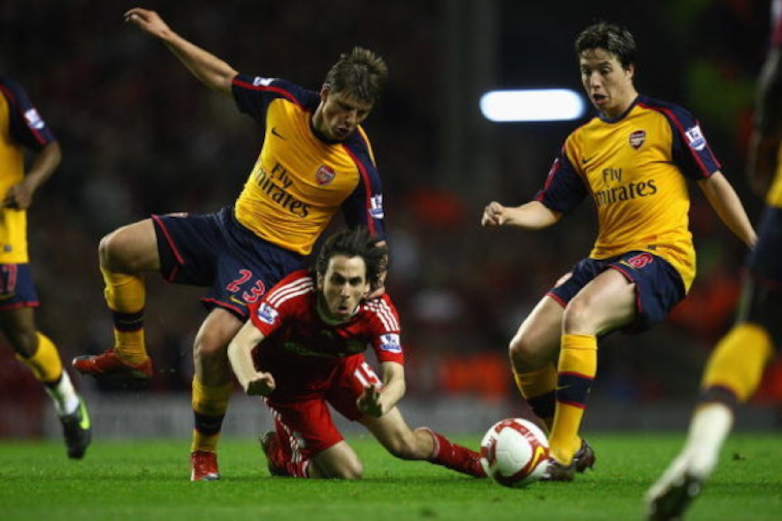 LIVERPOOL, UNITED KINGDOM - APRIL 21:  Andrey Arshavin of Arsenal  tangles with Yossi Benayoun of Liverpool during the Barclays Premier League match between Liverpool and Arsenal at Anfield on April 21, 2009 in Liverpool, England.  (Photo by Laurence Grif
