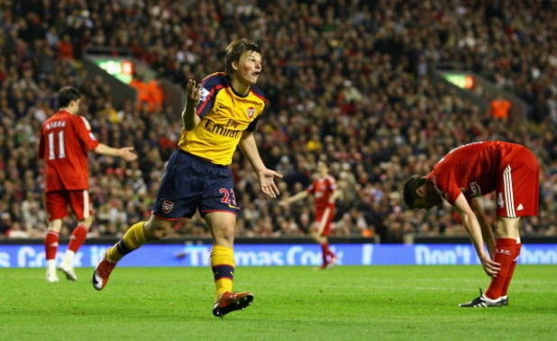 LIVERPOOL, UNITED KINGDOM - APRIL 21:  Andrey Arshavin of Arsenal  celebrates scoring his team's third goal and his hat trick during the Barclays Premier League match between Liverpool and Arsenal at Anfield on April 21, 2009 in Liverpool, England.  (Phot