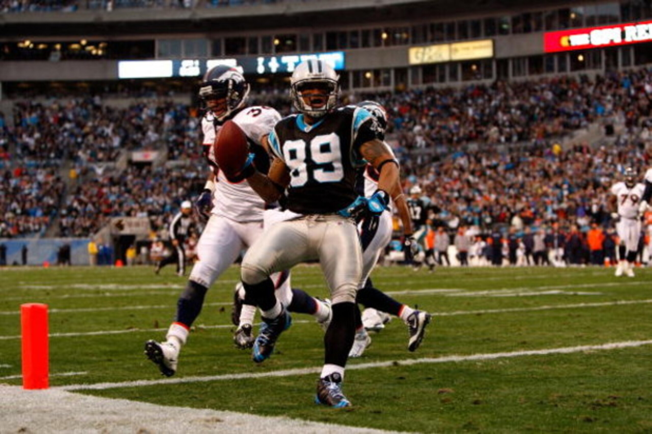 CHARLOTTE, NC - DECEMBER 14:  Steve Smith #89 of the Carolina Panthers scores a touchdown against the Denver Broncos during their game at Bank of America Stadium on December 14, 2008 in Charlotte, North Carolina  (Photo by Streeter Lecka/Getty Images)