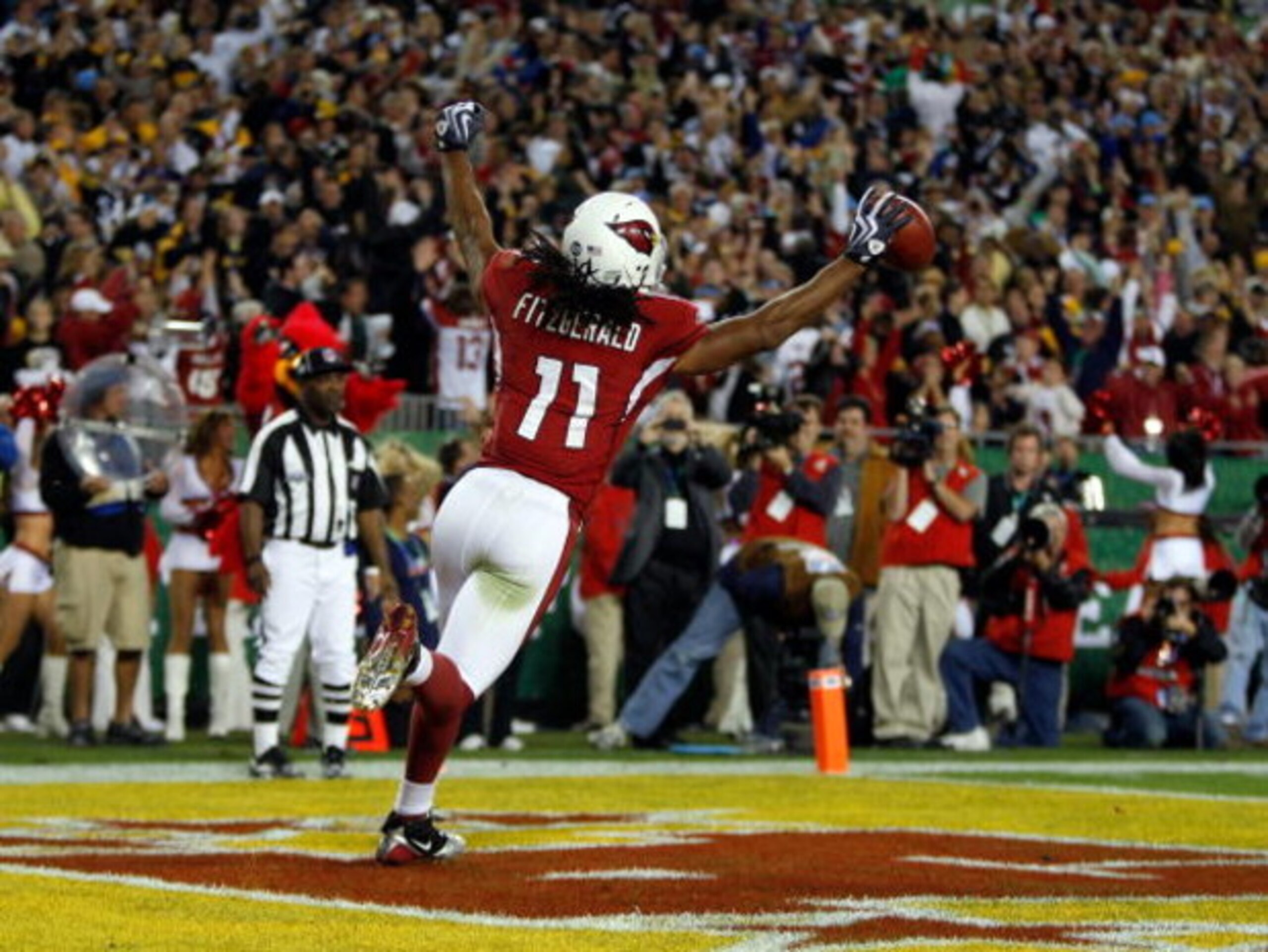 TAMPA, FL - FEBRUARY 01:  Larry Fitzgerald #11 of the Arizona Cardinals celebrates after scoring a touchdown in the fourth quarter against the Pittsburgh Steelers during Super Bowl XLIII on February 1, 2009 at Raymond James Stadium in Tampa, Florida.  (Ph
