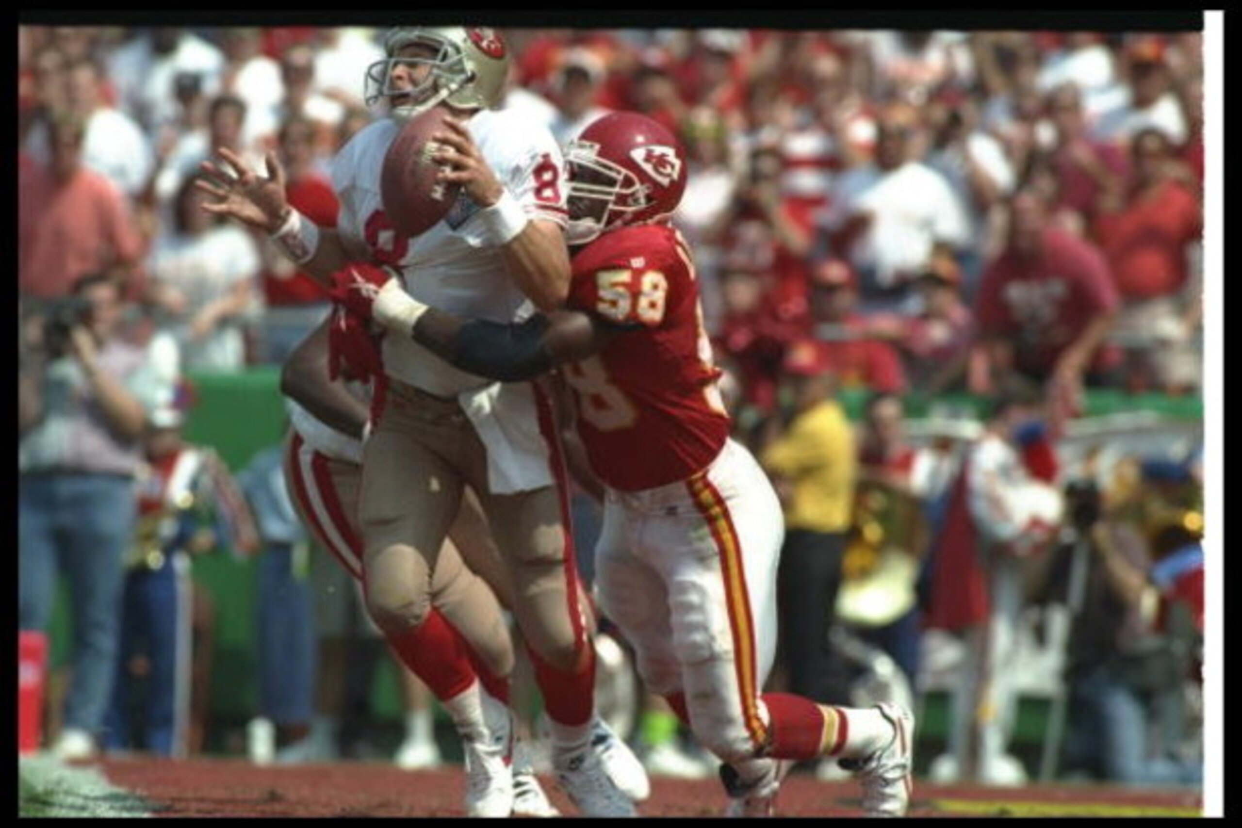 11 Sep 1994:  Linebacker Derrick Thomas of the Kansas City Chiefs sacks San Francisco 49ers quarterback Steve Young during a game at Arrowhead Stadium in Kansas City, Missouri.  The Chiefs won the game, 24-17. Mandatory Credit: Mike Powell  /Allsport