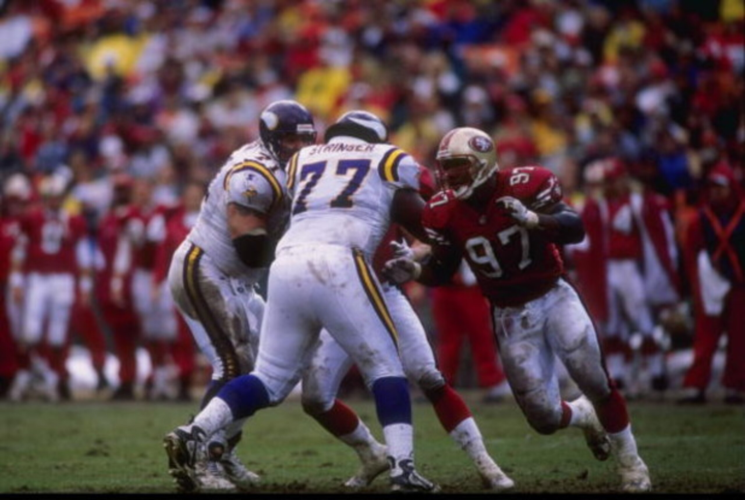7 Dec 1997:  Bryant Young #97 of the San Francisco 49ers runs around Korey Stringer #77 of the Minnesota Vikings during a game at 3Com Park in San Francisco, California. The 49ers defeated the Vikings 28-17. Mandatory Credit: Otto Greule Jr.  /Allsport