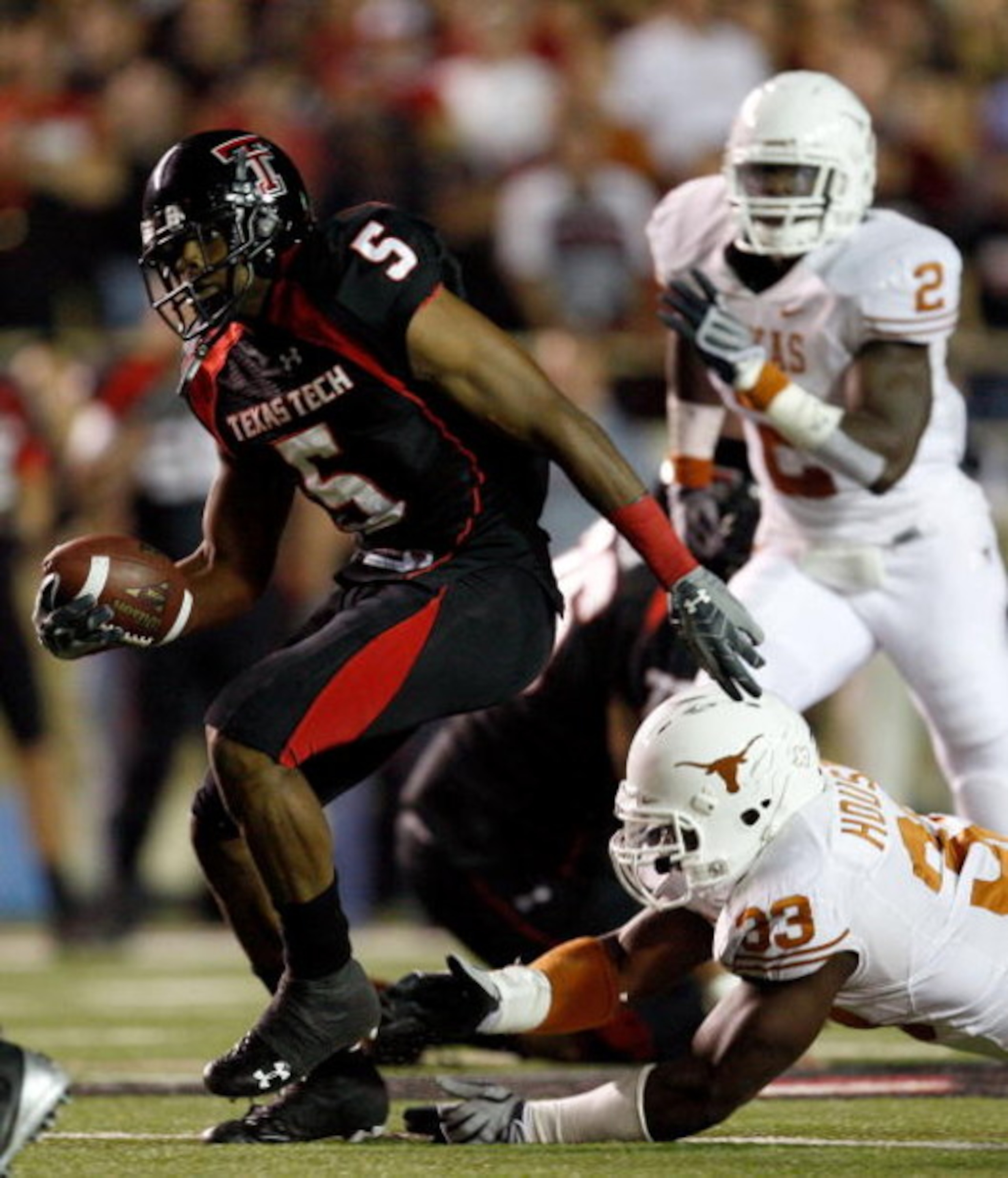 LUBBOCK, TX - NOVEMBER 01: Michael Crabtree #5 of the Texas Tech Red Raiders carries the ball after making a reception during the first half of the game against the Texas Longhorns on November 1, 2008 at Jones Stadium in Lubbock, Texas. (Photo by Jamie LUBBOCK, TX - NOVEMBER 01: Michael Crabtree #5 of the Texas Tech Red Raiders carries the ball after making a reception during the first half of the game against the Texas Longhorns on November 1, 2008 at Jones Stadium in Lubbock, Texas. (Photo by Jamie
